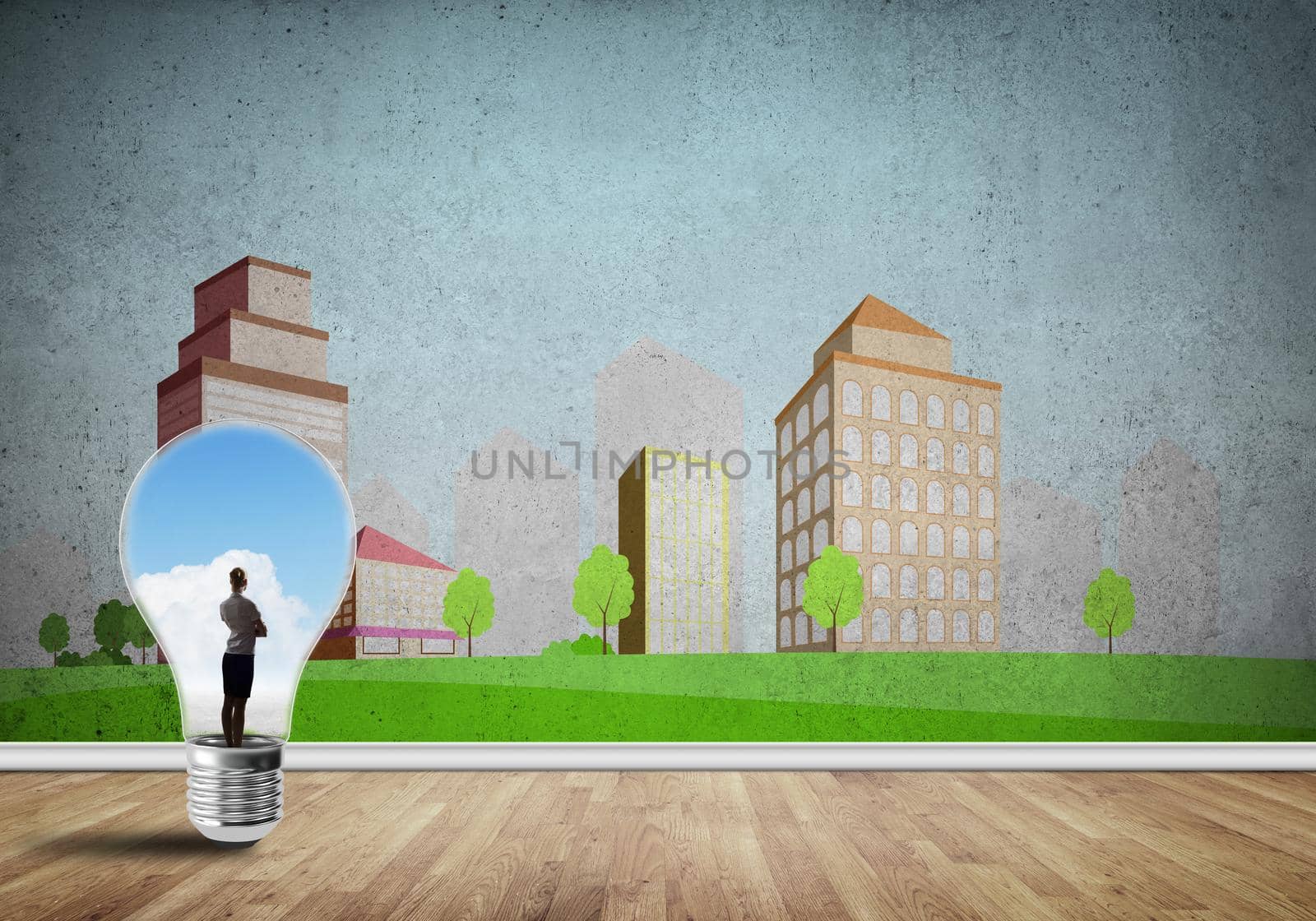 Businesswoman inside light bulb against city drawn concept