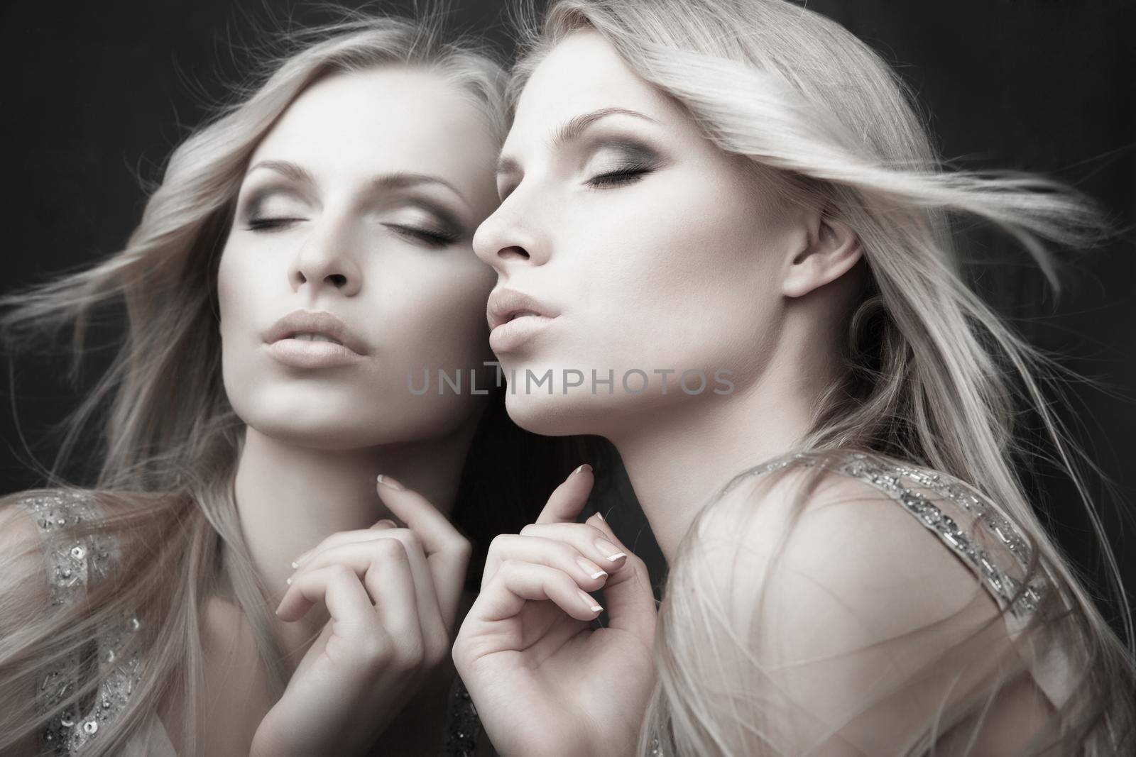 Beautiful sexy young woman near mirror over grey by Julenochek