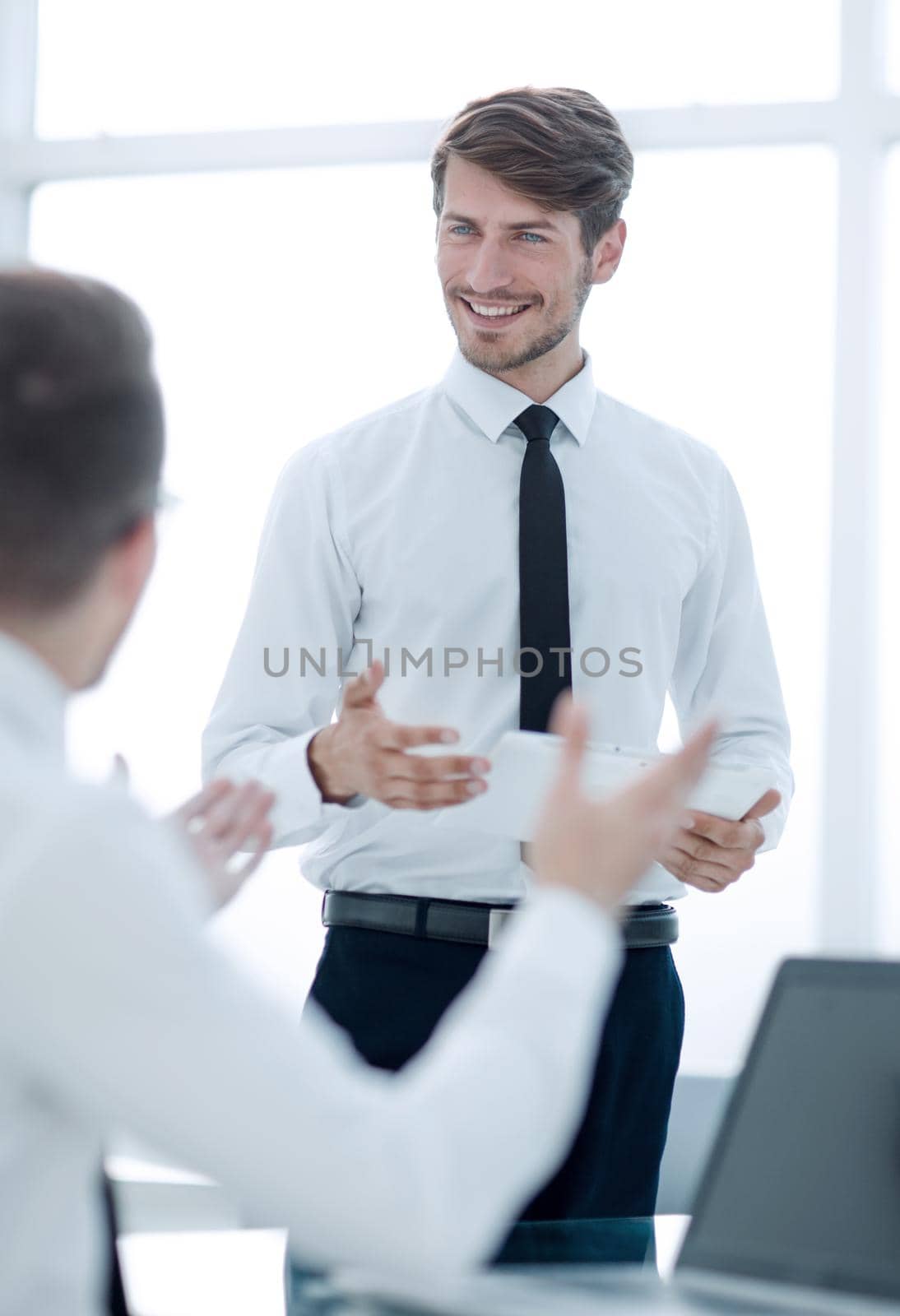 businessman discussing new app with partner holding digital tablet, team talking during coffee break using business gadget