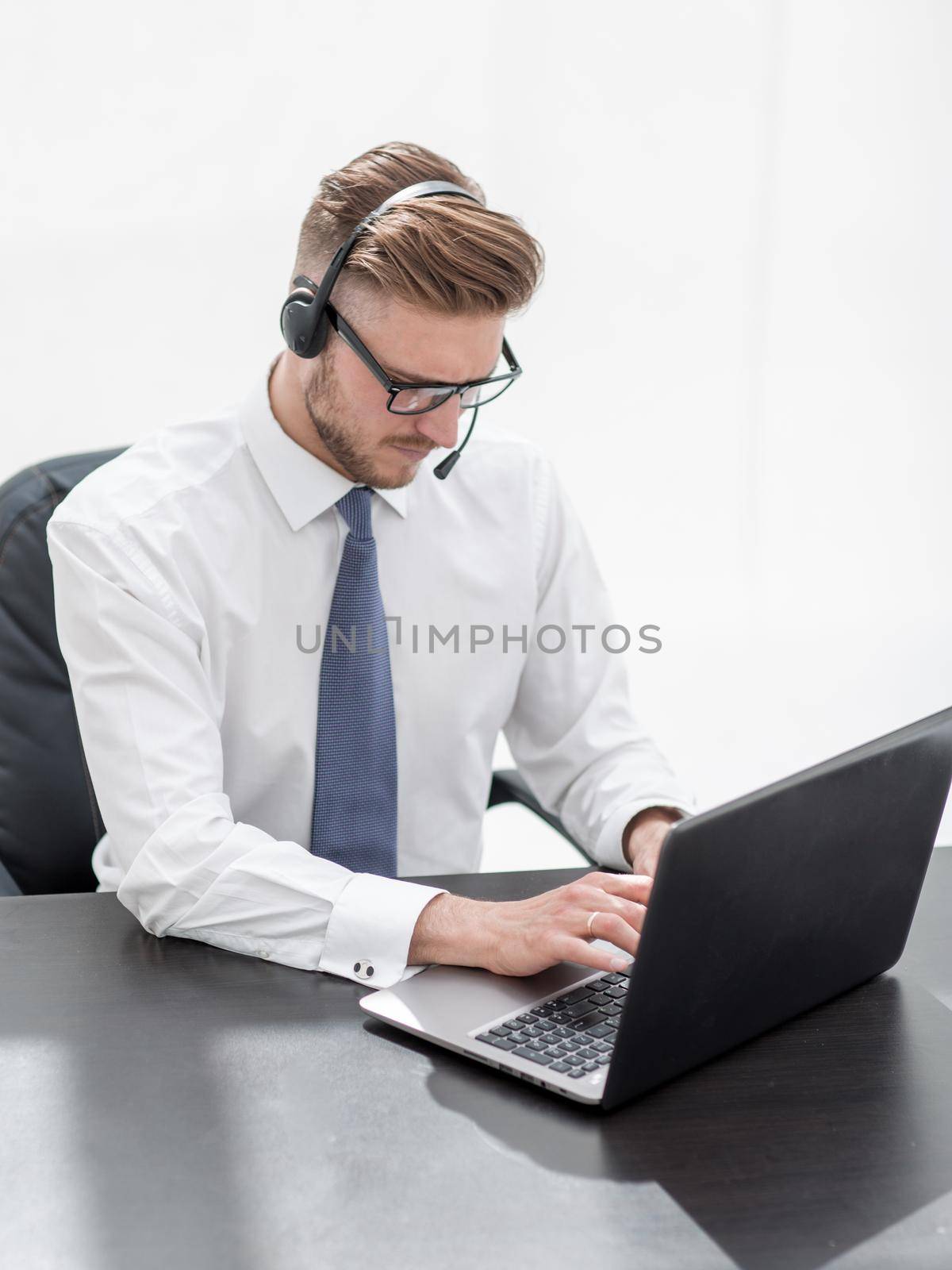 business center employee working on a laptop .photo with copy space