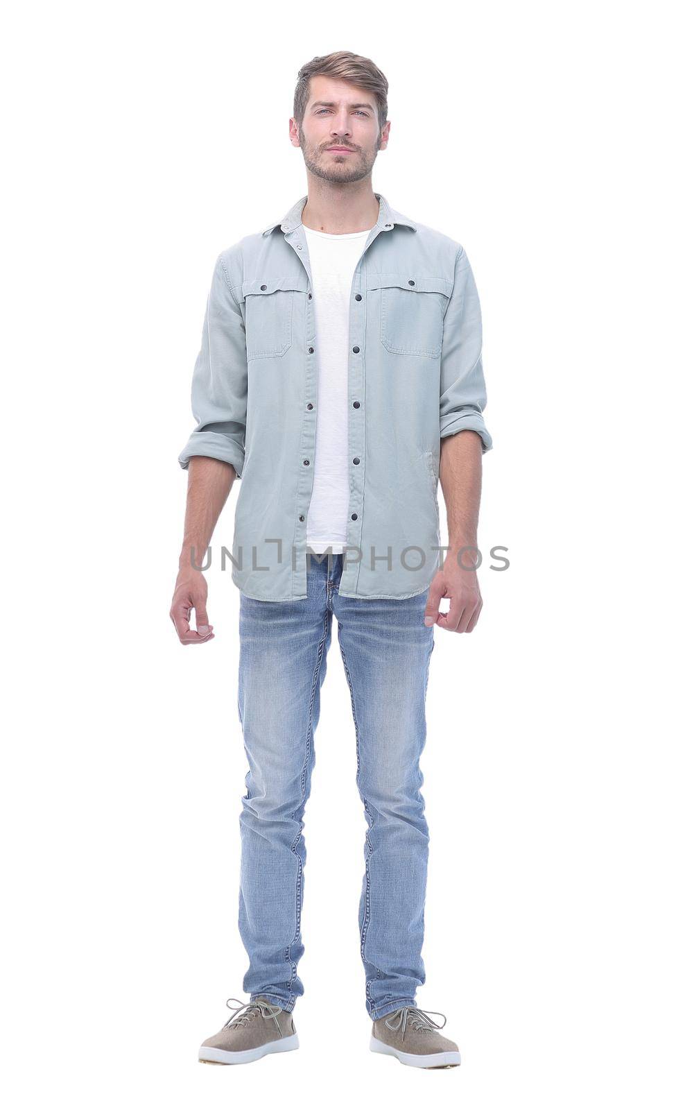 in full growth.handsome modern guy in jeans.isolated on white background