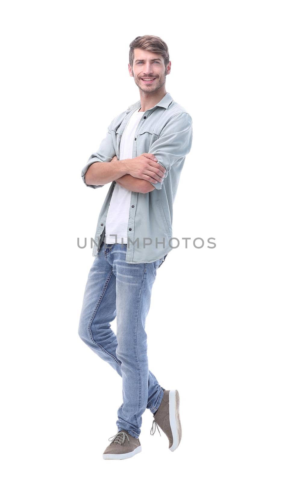 in full growth. smiling young man in jeans.isolated on white background