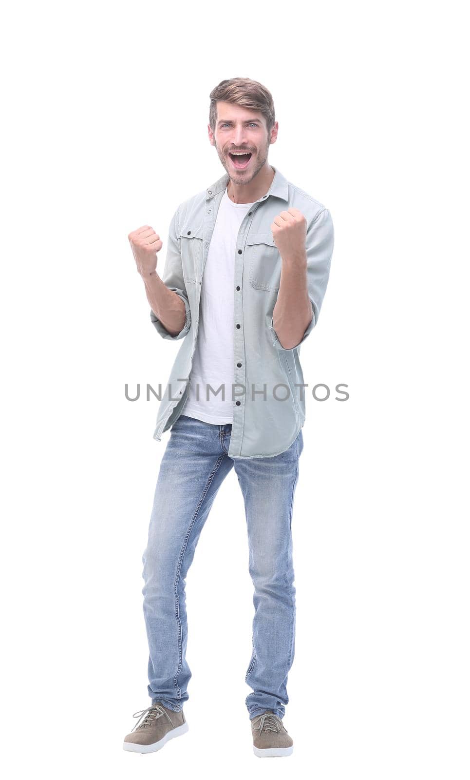 in full growth.happy young man in jeans.isolated on white background