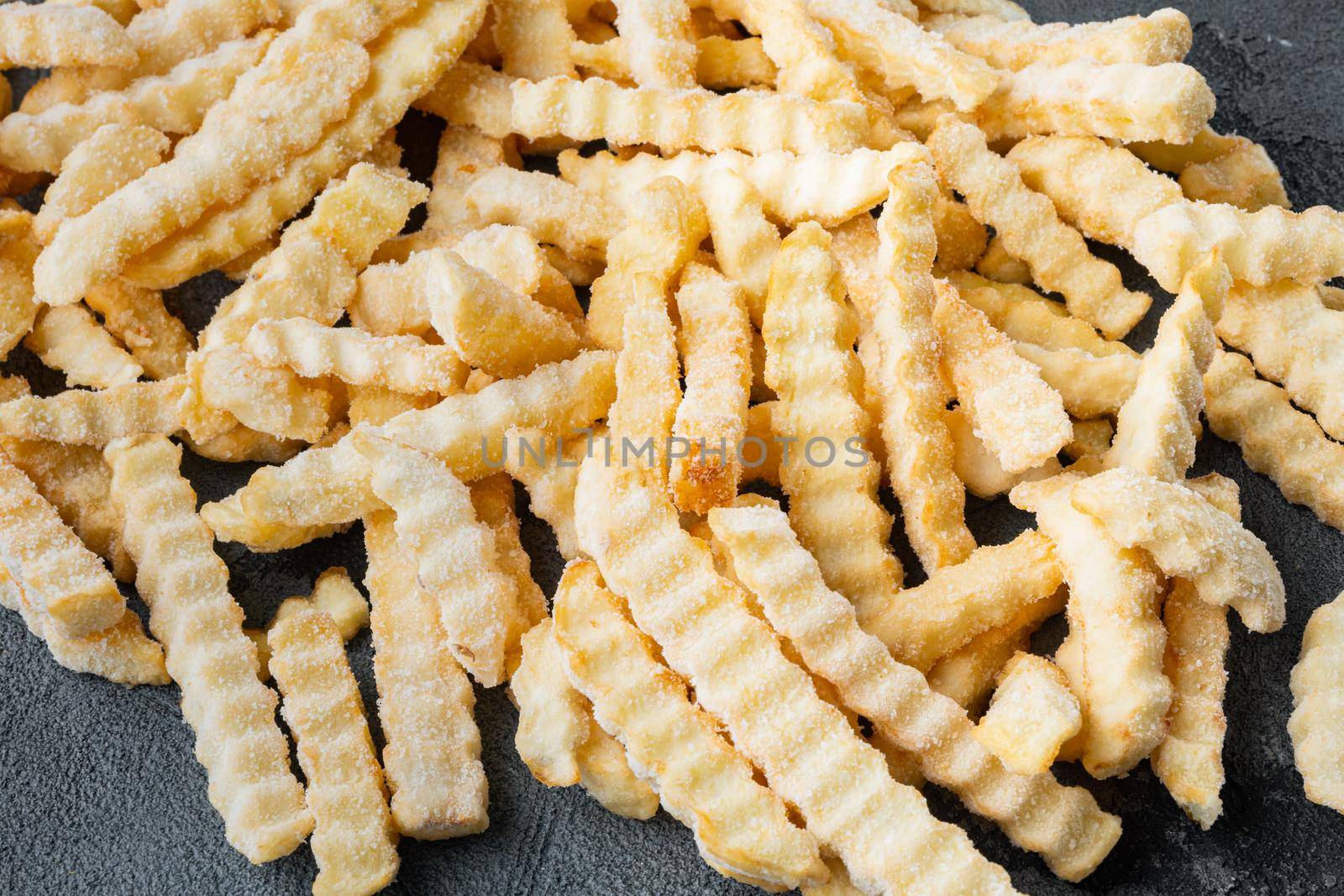 Frozen oven chips sliced potato set, on gray background