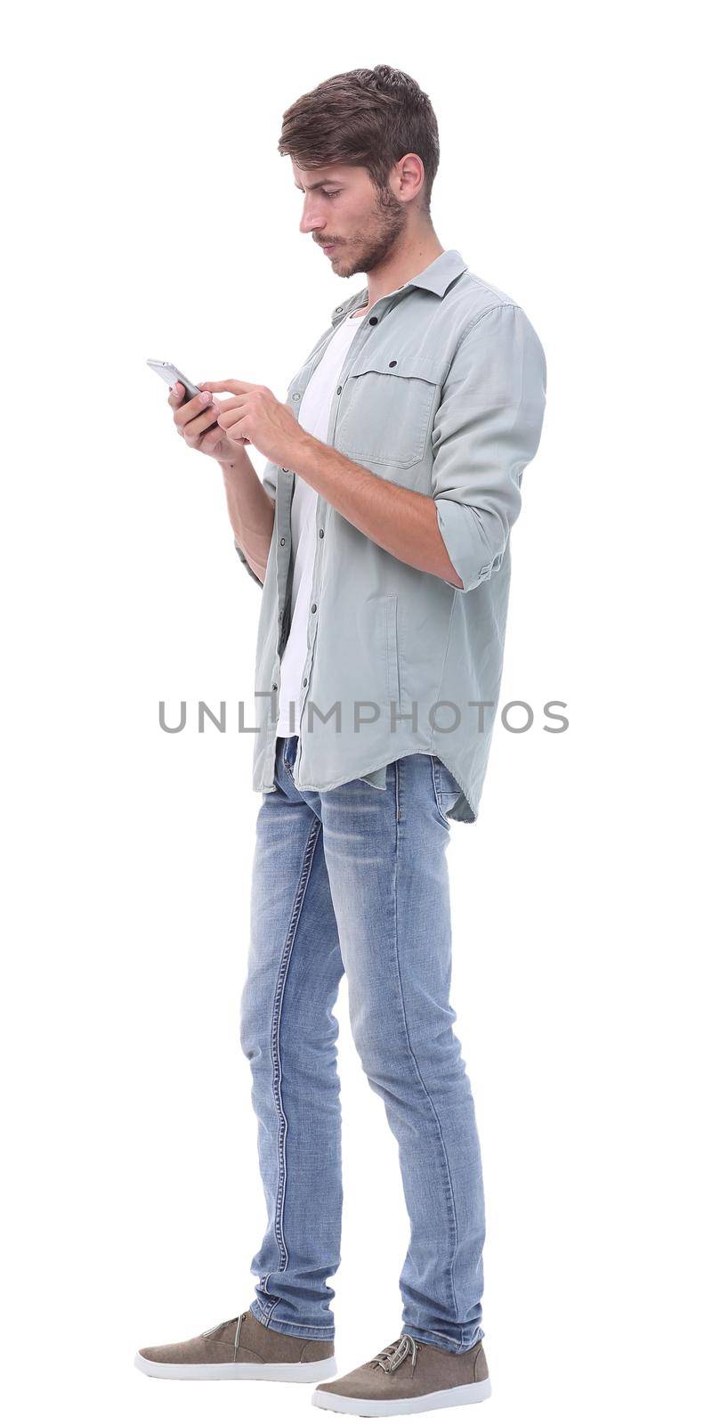 in full growth.surprised young man with smartphone .isolated on white background