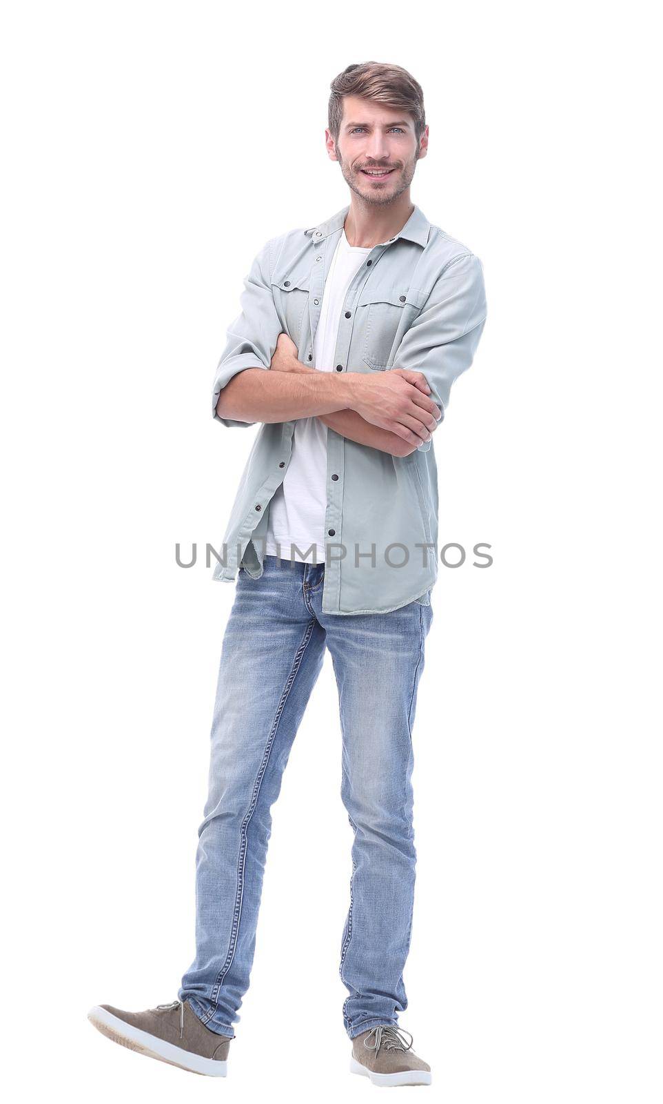 in full growth. smiling young man in jeans.isolated on white background