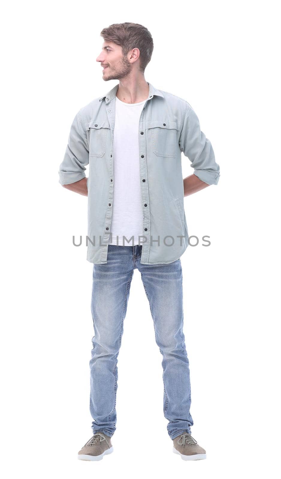 in full growth. portrait of modern young man looking away .isolated on white background