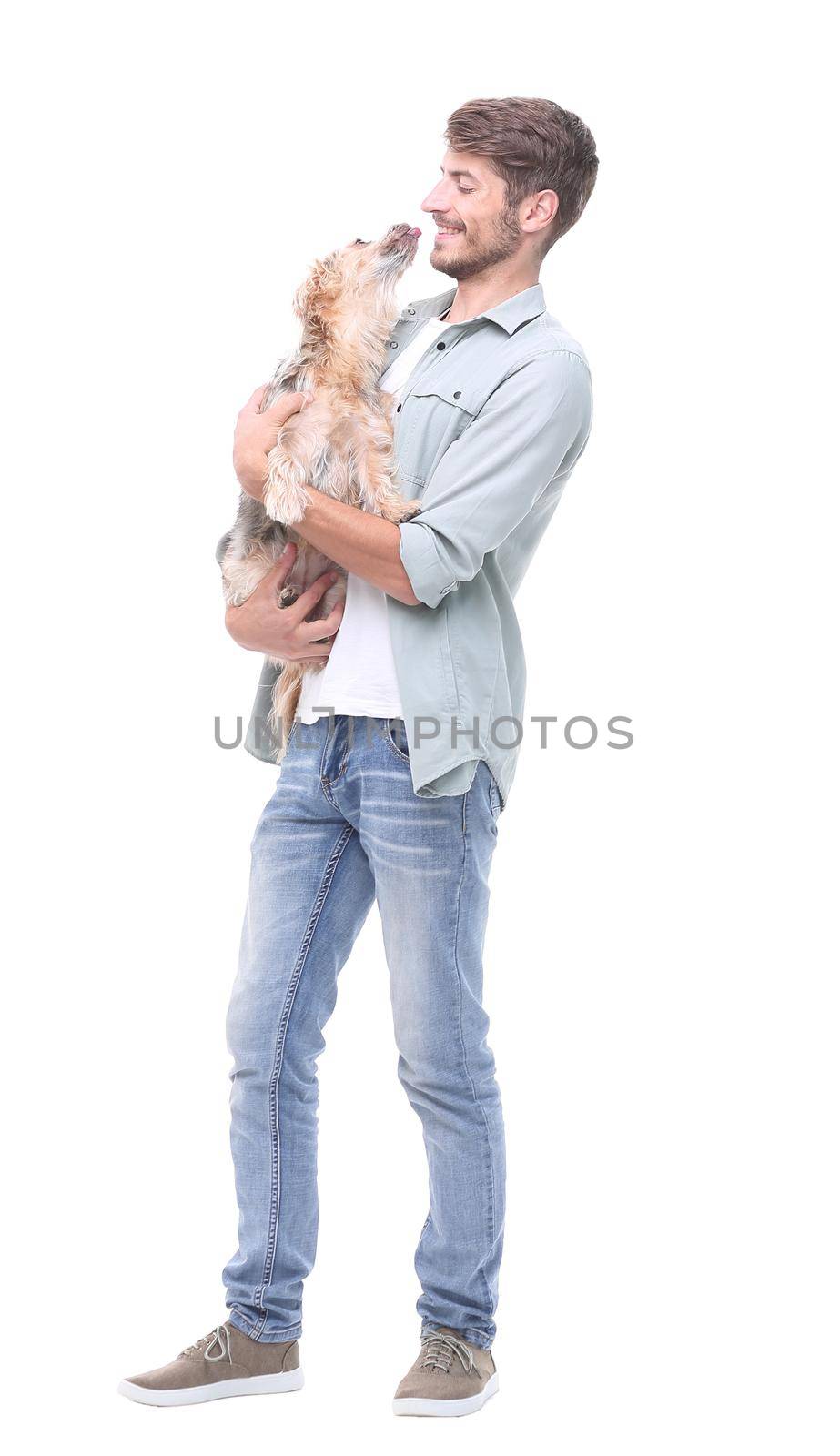 in full growth. a young man with his dog .isolated on white background