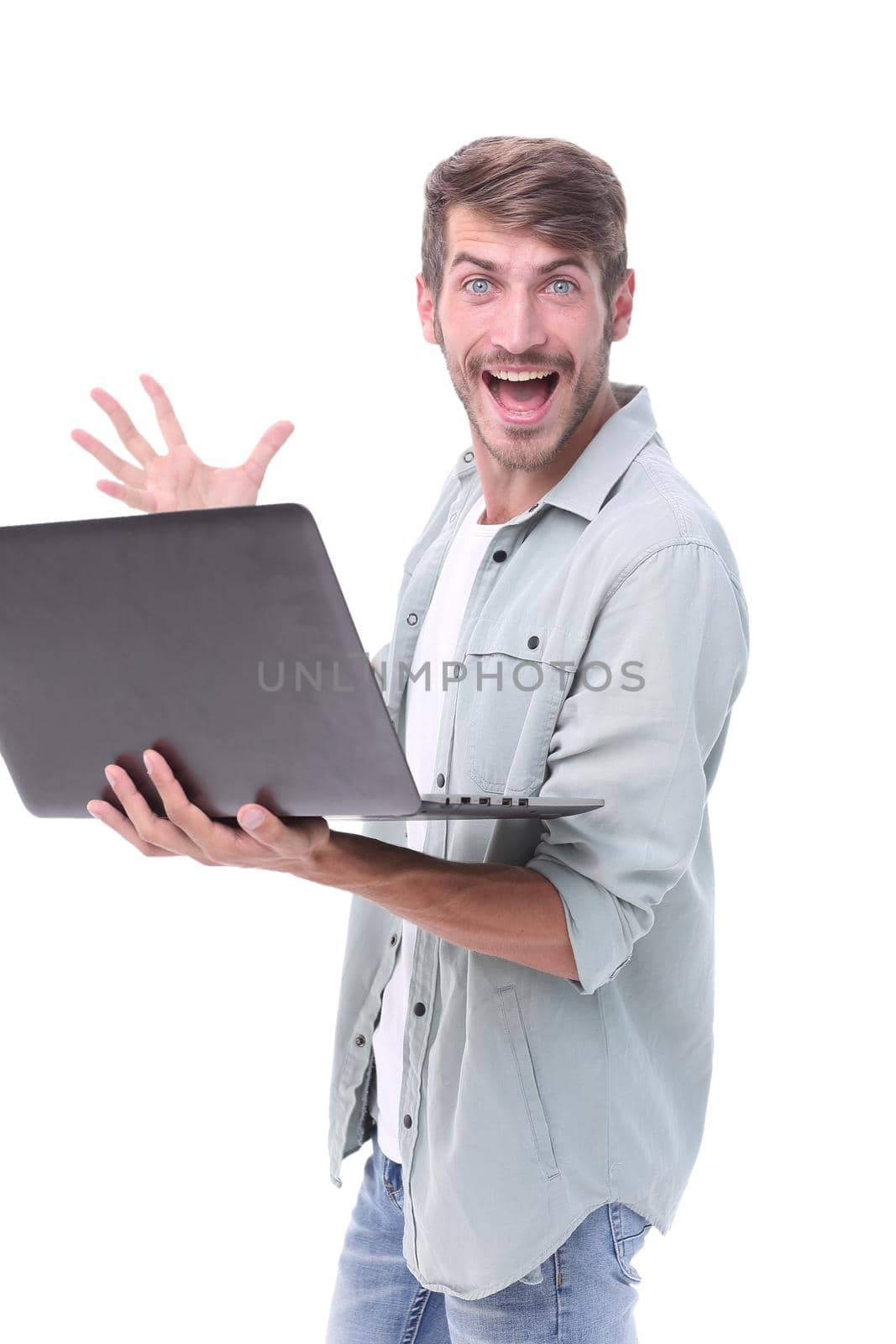 close up. successful young man with a laptop .isolated on white background