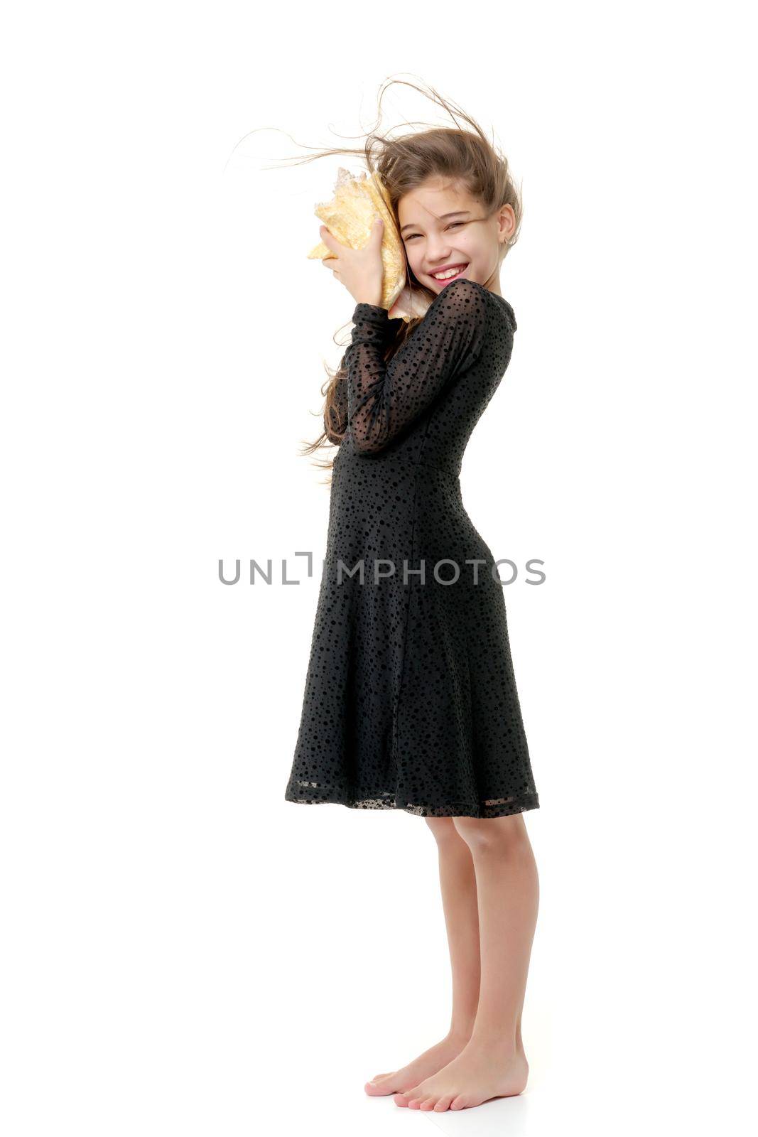 A little girl with a sea shell. The concept of a family vacation at sea, ecology. Isolated on white background.