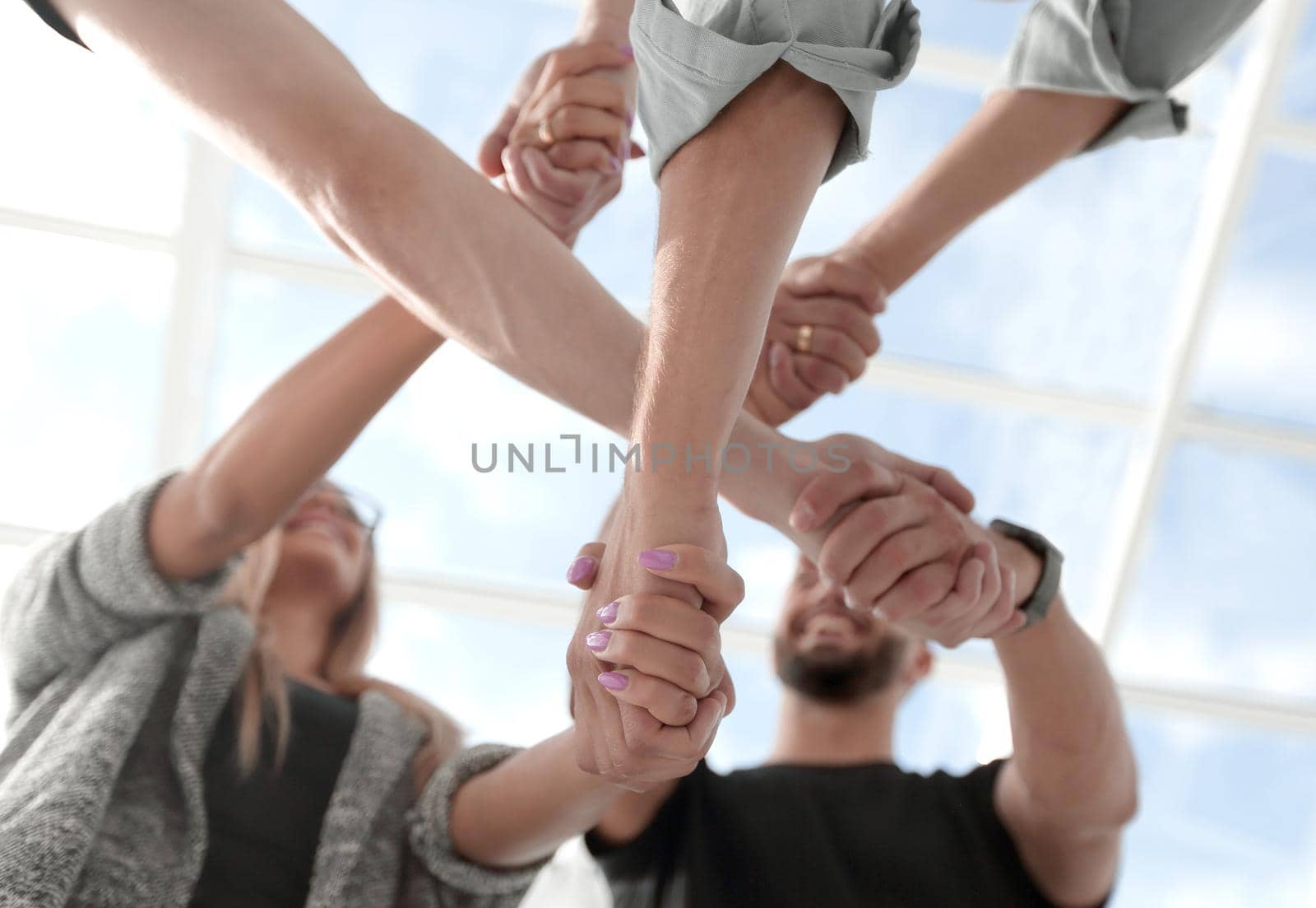 Team Work Concept : Group of Diverse Hands Together Cross Processing of young people in the office