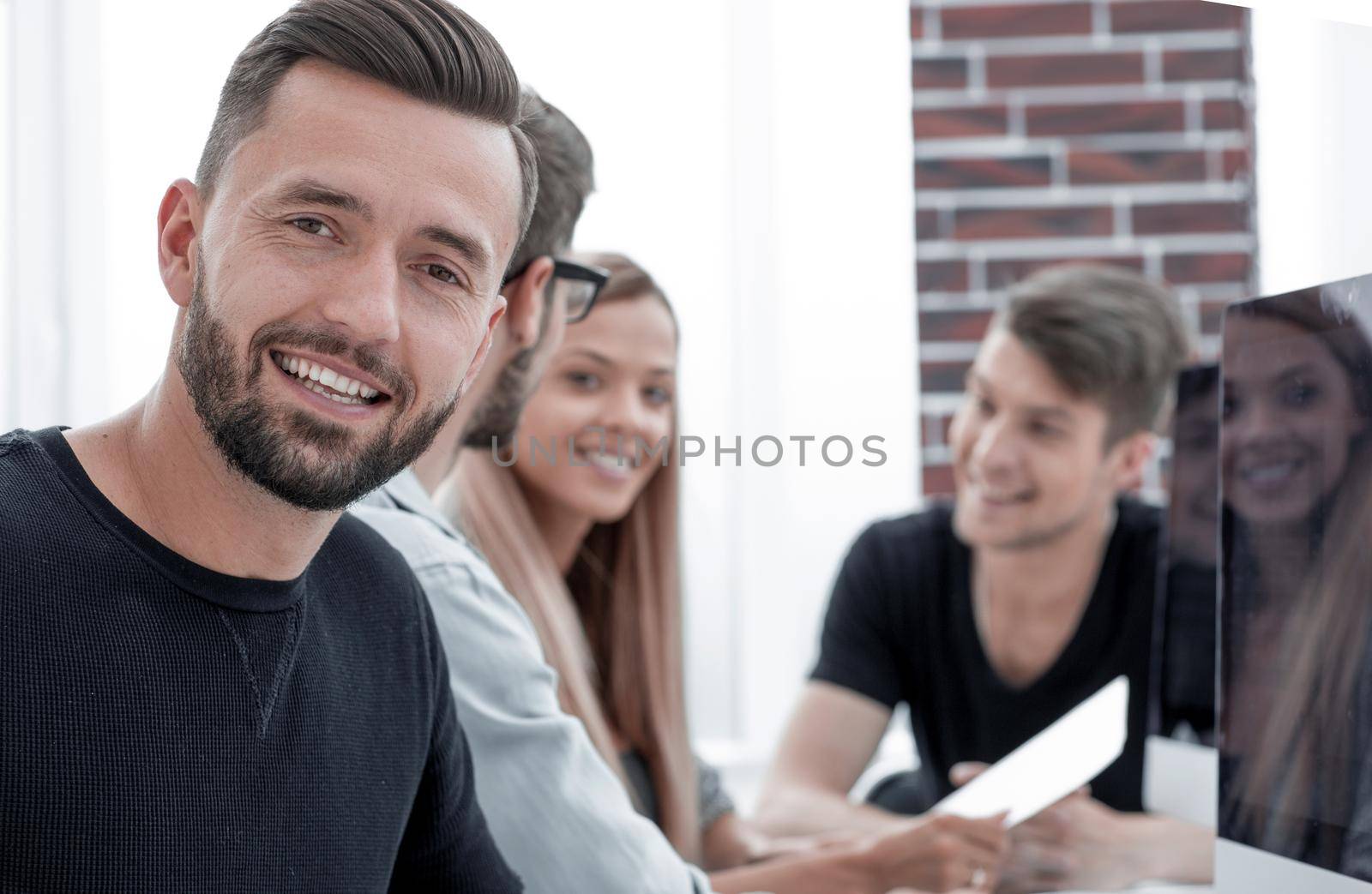 men is smiling during break, near modern office center. Young businessman lifestyle portrait. Technology and online communication concept