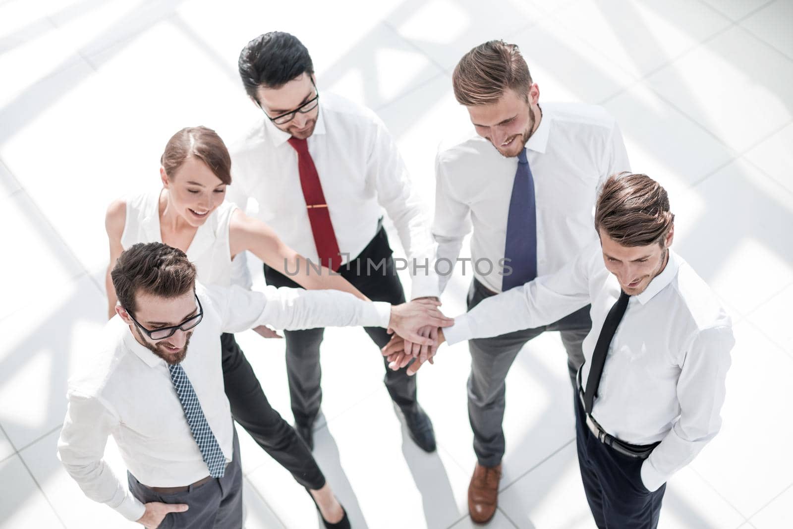 top view. young employees showing their unity. photo with copy space