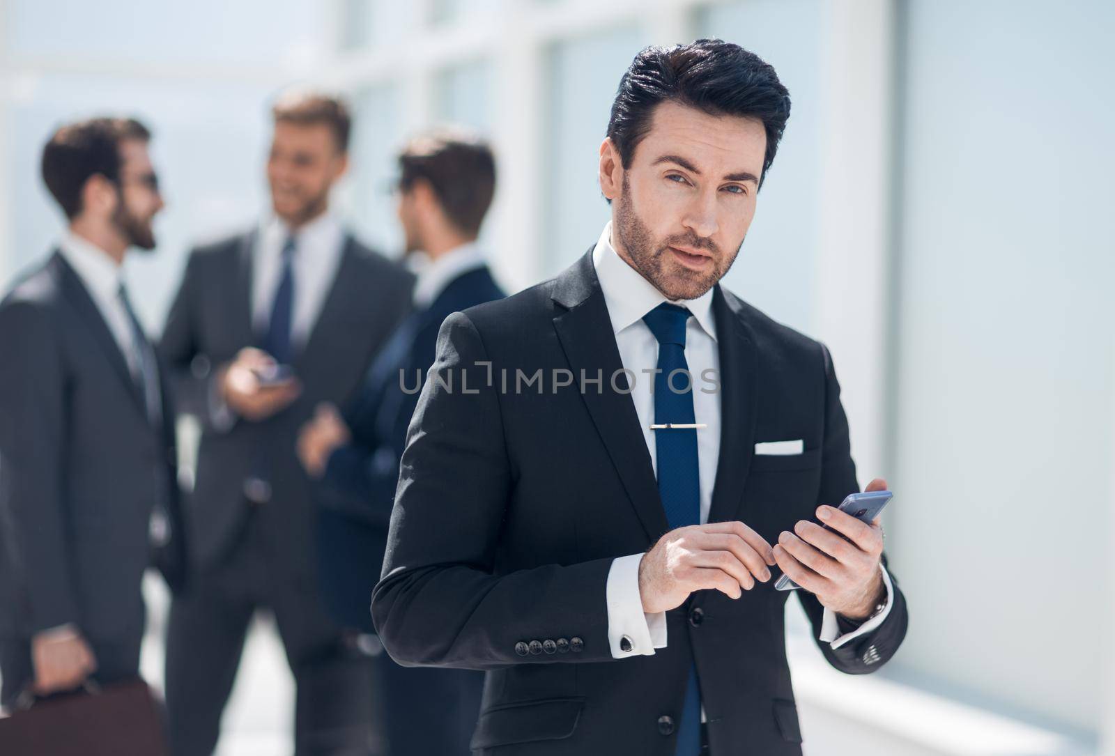 businessman looking at the smartphone screen .people and technology