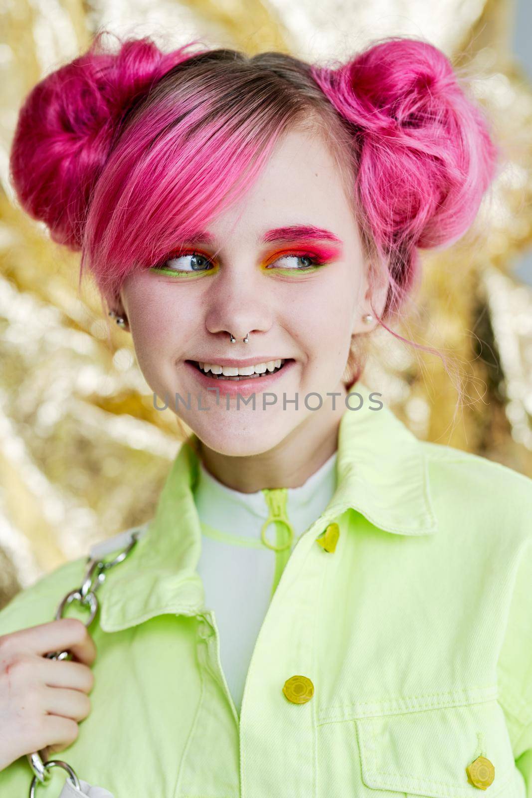 pretty cheerful woman with pink hair bright makeup posing. High quality photo