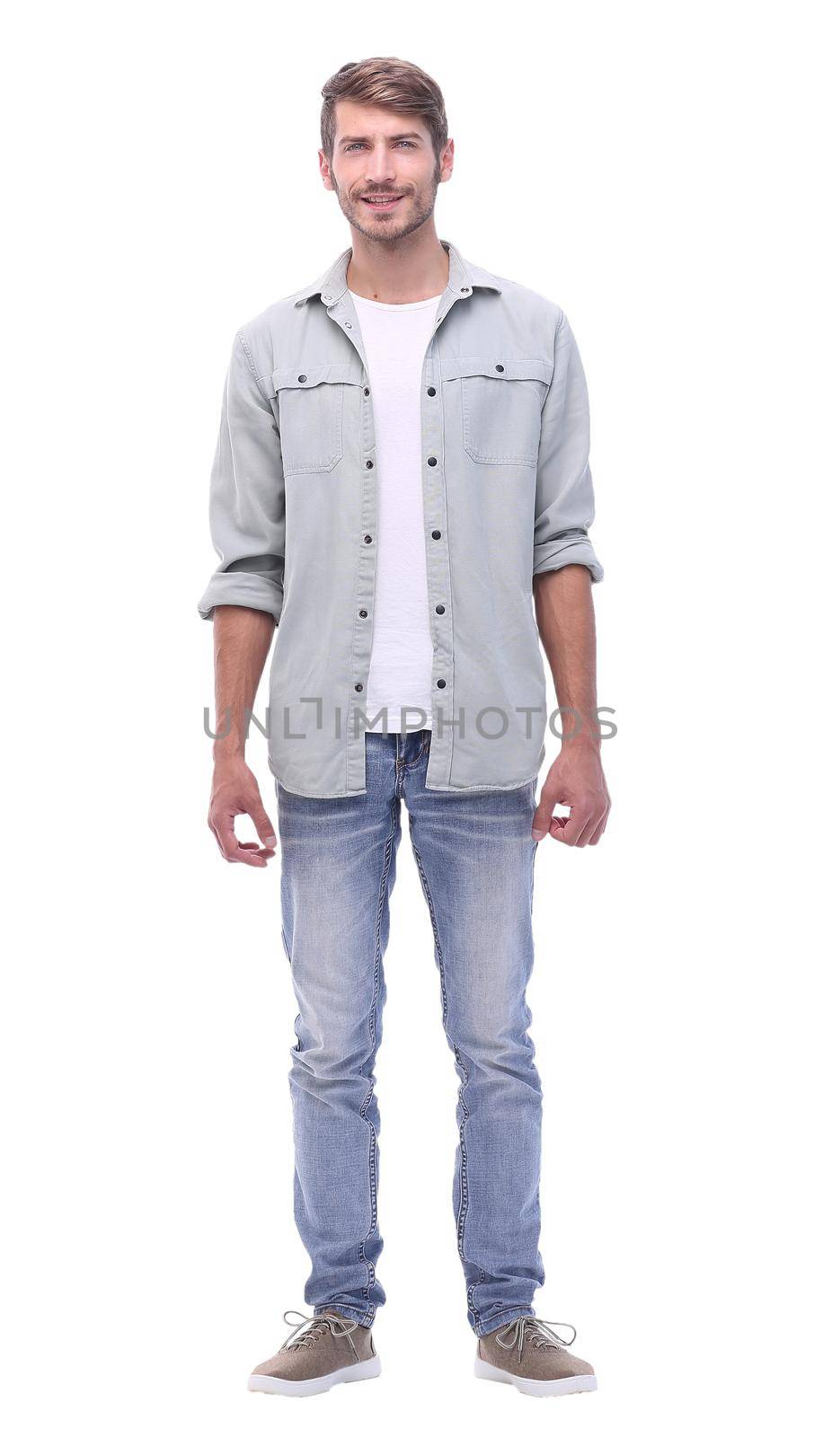 in full growth.handsome modern guy in jeans.isolated on white background