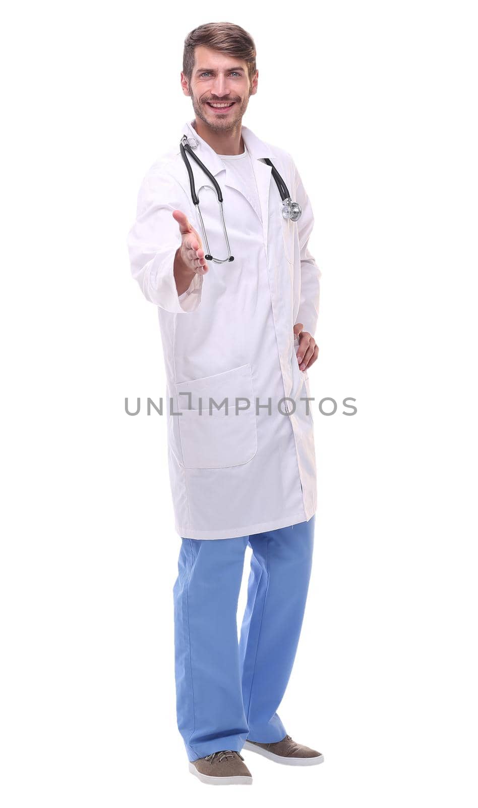 in full growth. doctor therapist holding out his hand for a handshake.isolated on white background