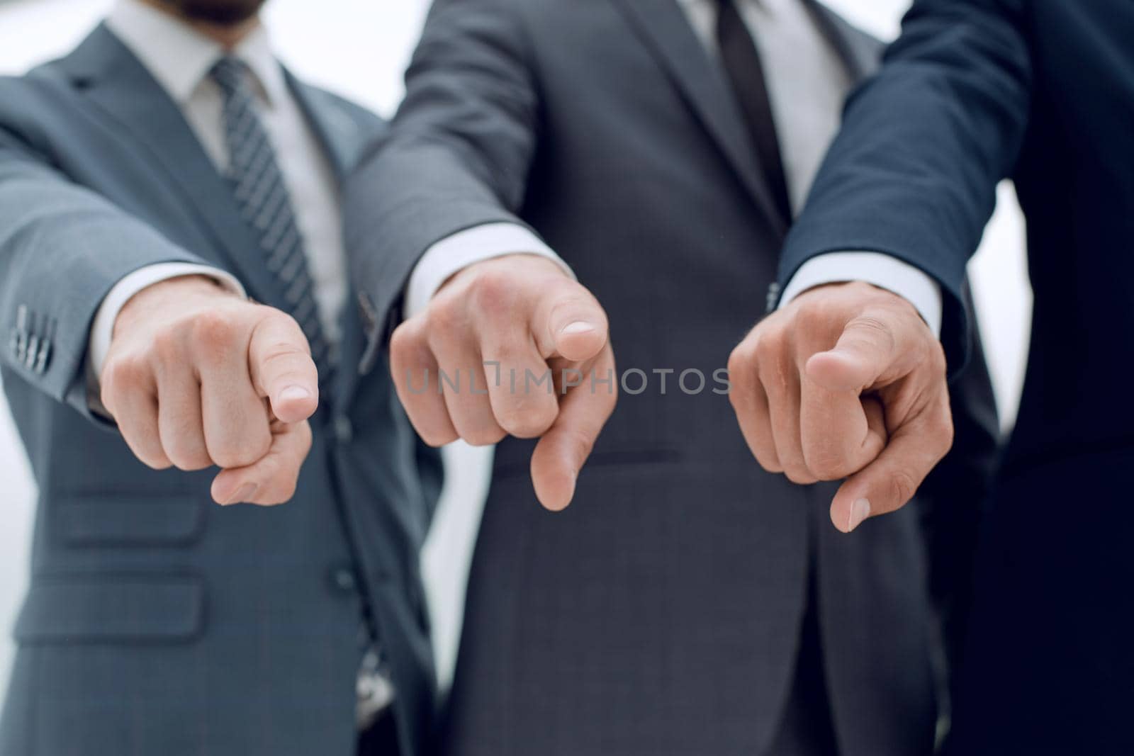 close up.three of a businessman pointing at you. the concept of choice .business concept