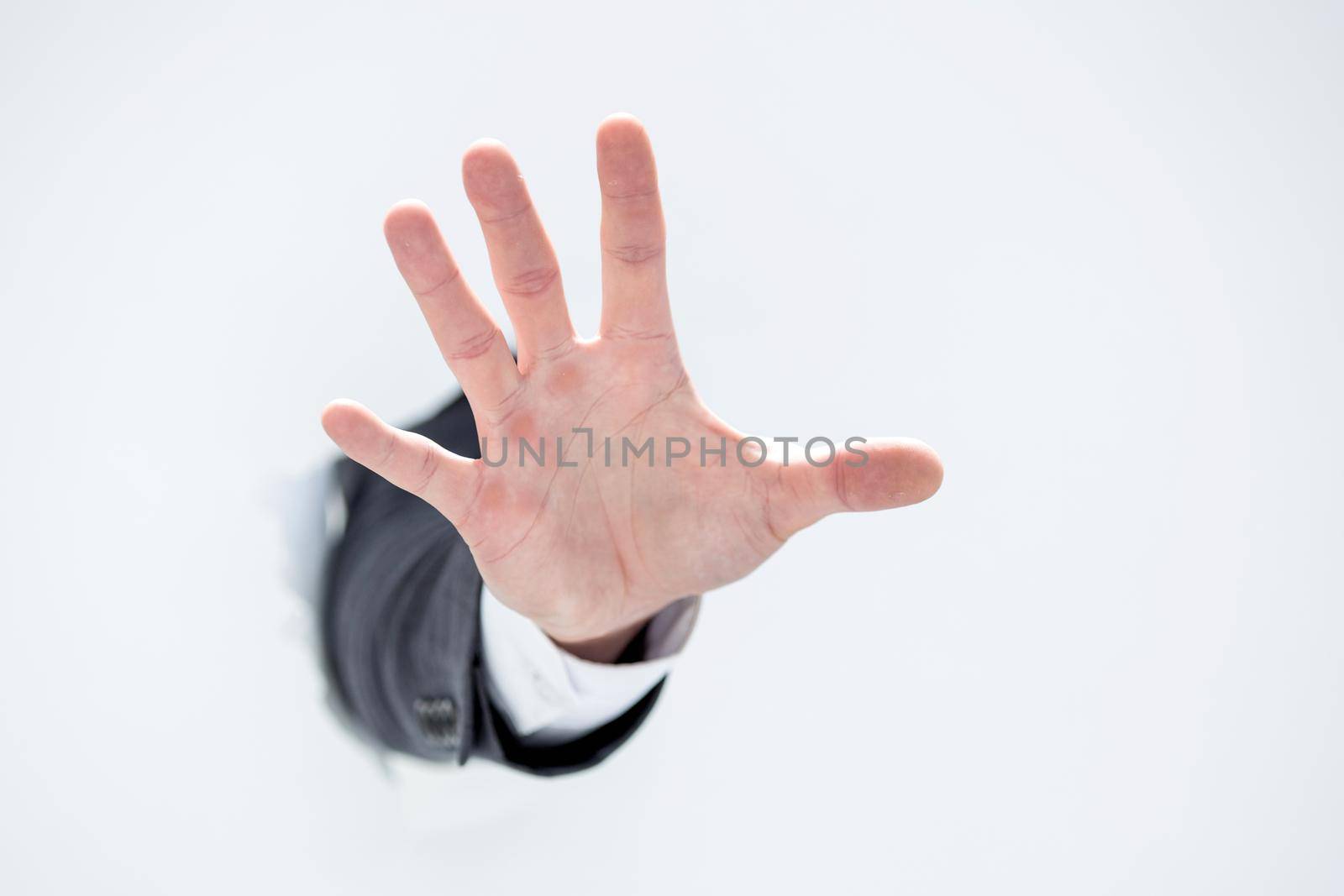 hand of a businessman showing stop gesture .photo with copy space
