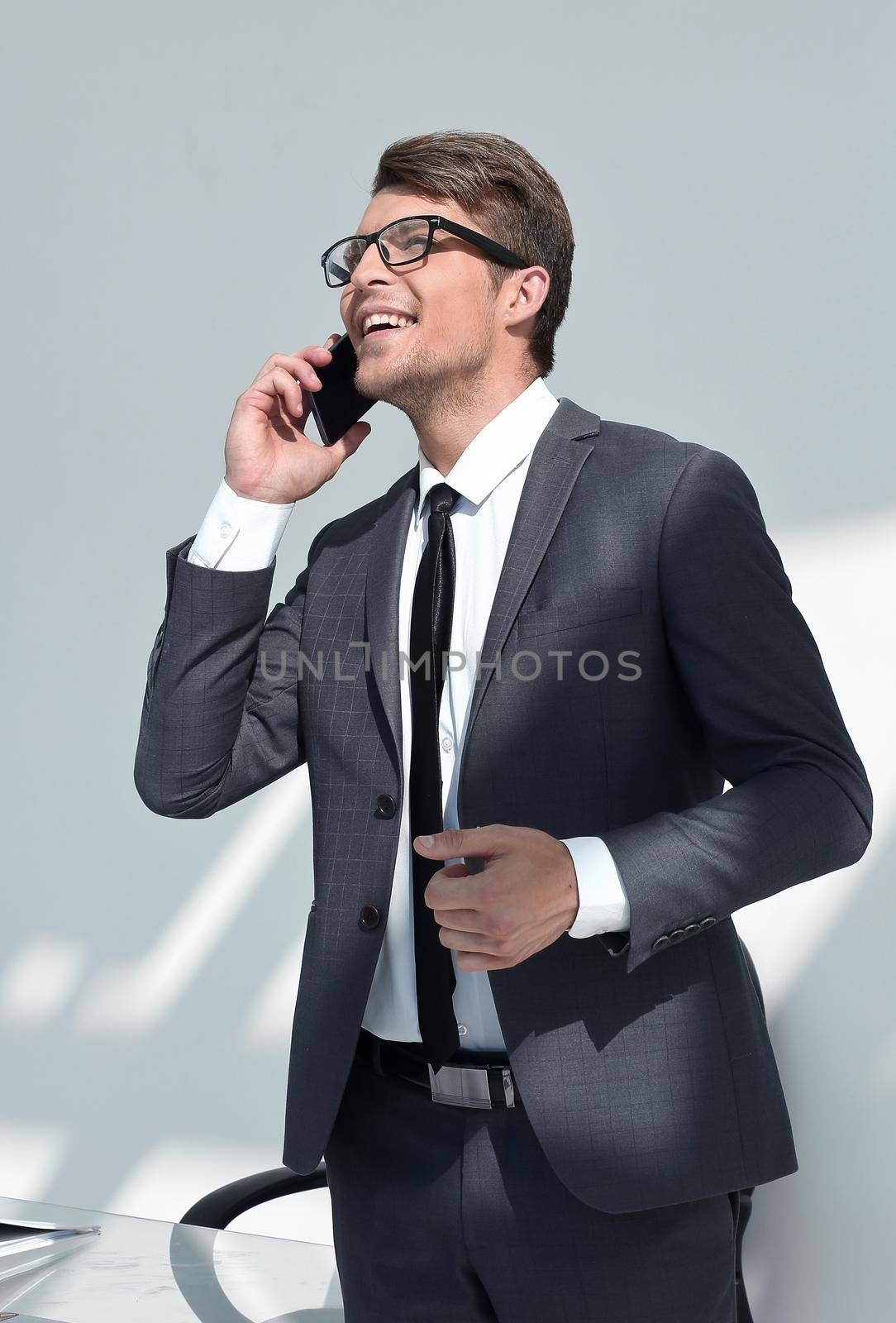 close up.modern businessman talking on the phone.people and technology