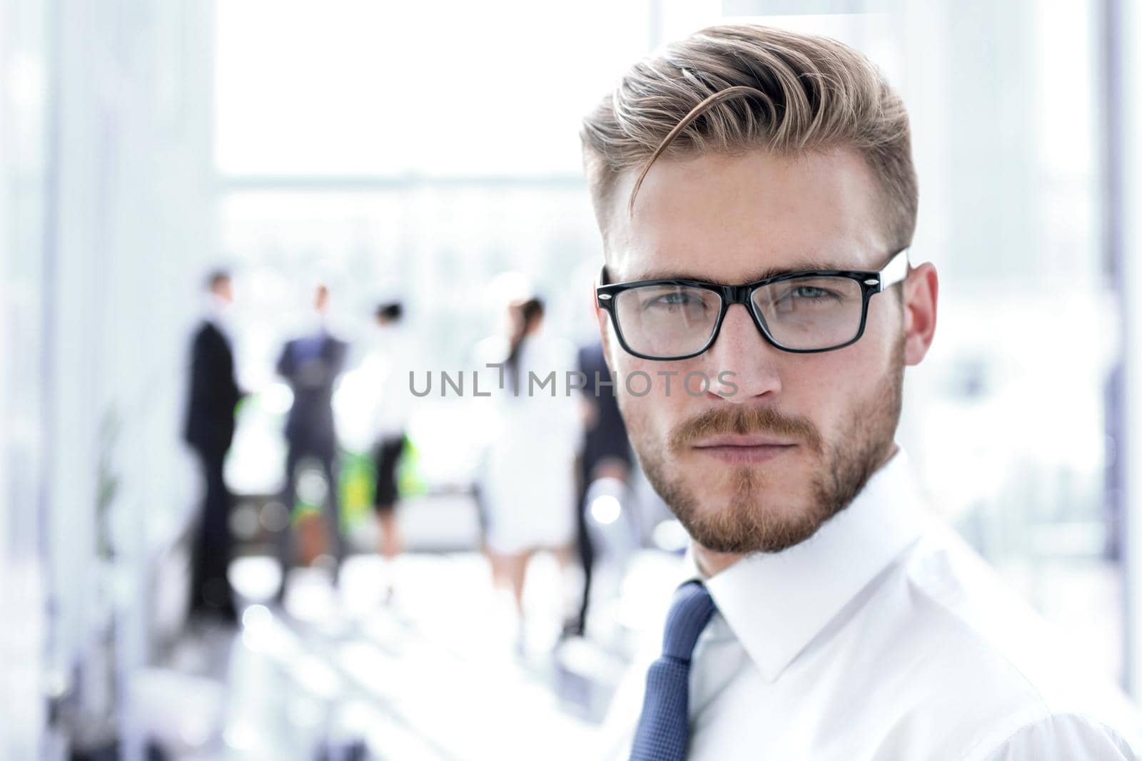 close up.portrait of a successful businessman on the background of the office