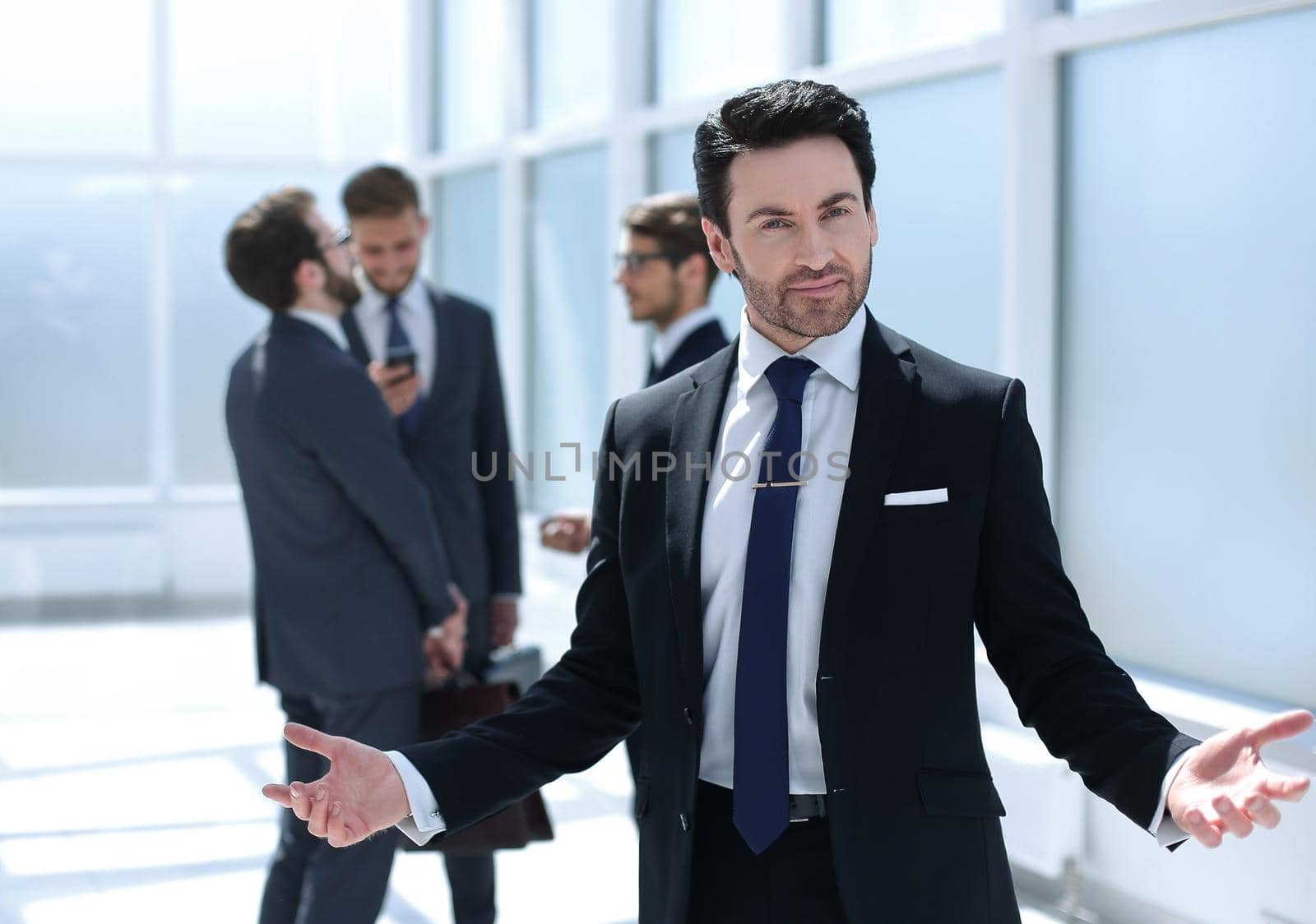 friendly businessman standing in the office.photo with copy space
