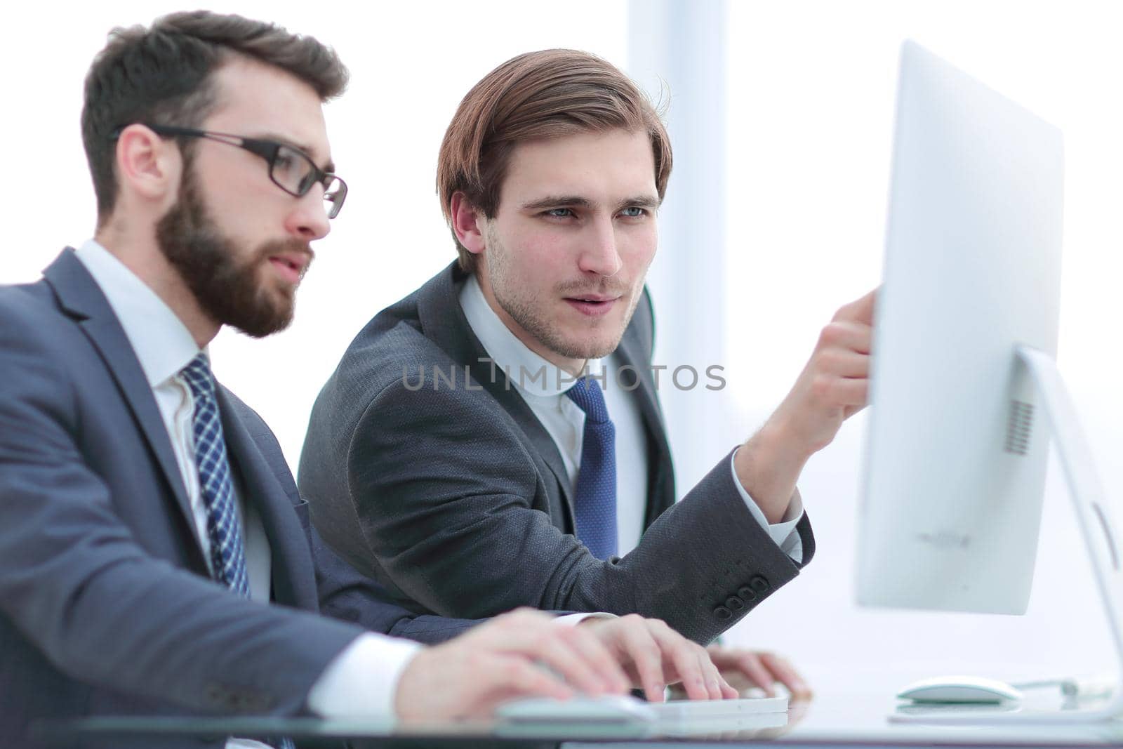 close up. colleagues are discussing new data, sitting at a Desk