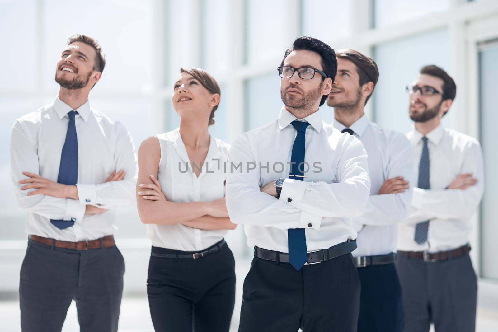 business team standing together and looking at copy space.business concept