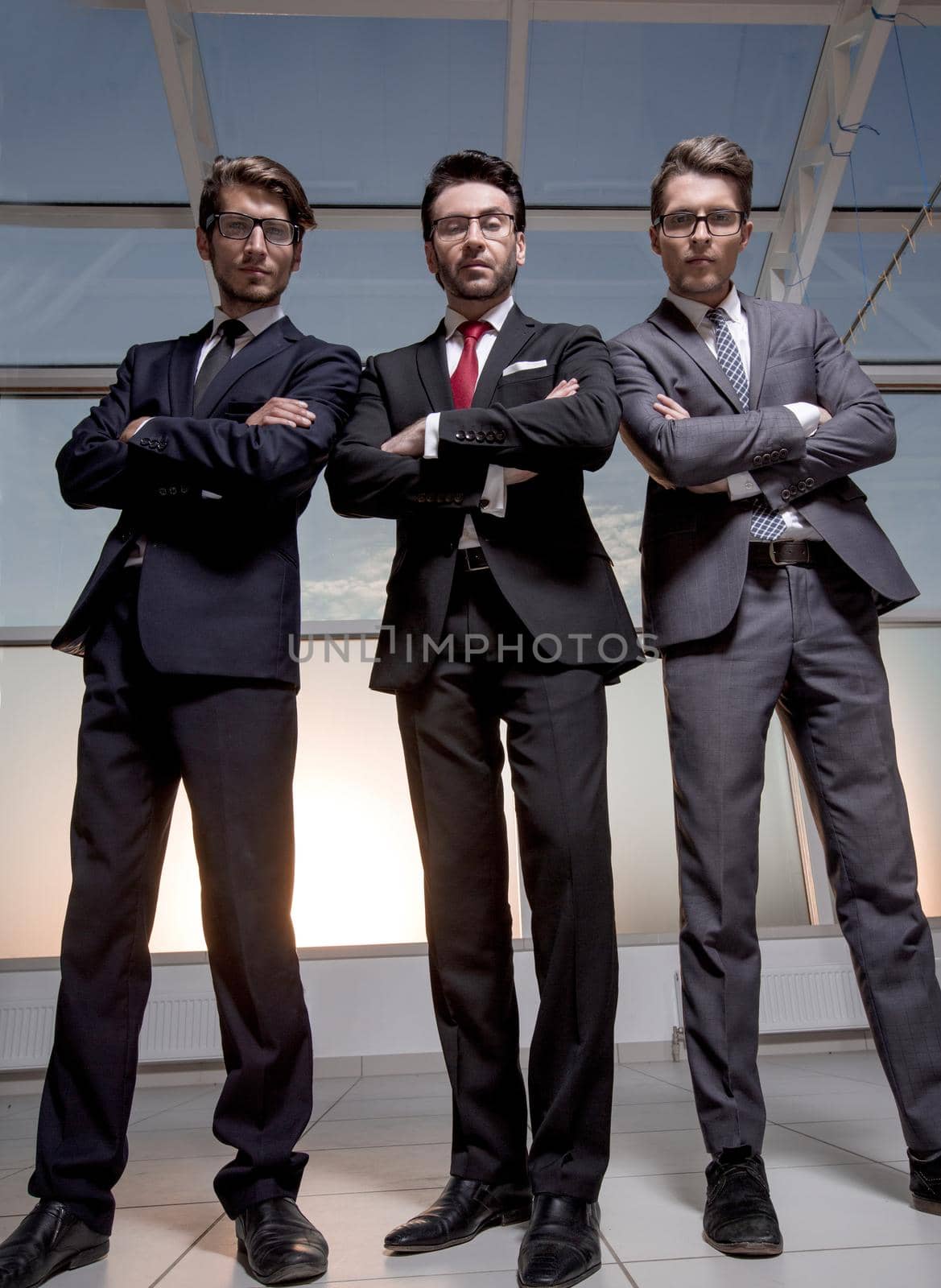 in full growth.three confident businessmen look forward.business concept