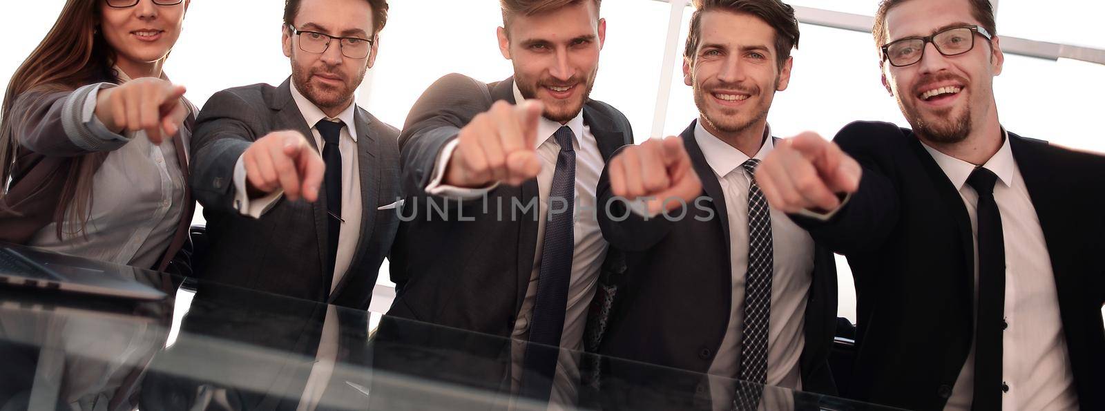 Businessmen in their office pointing to the front by asdf