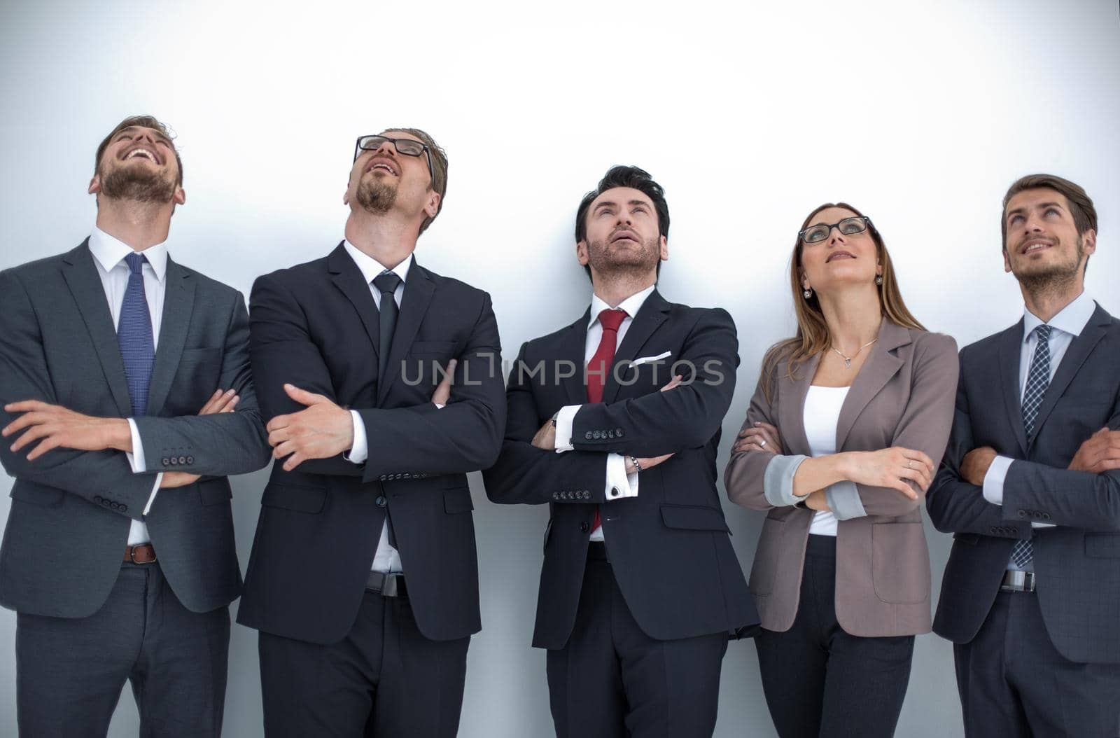 Happy positive business group looking up with dreaming expression.photo with copy space