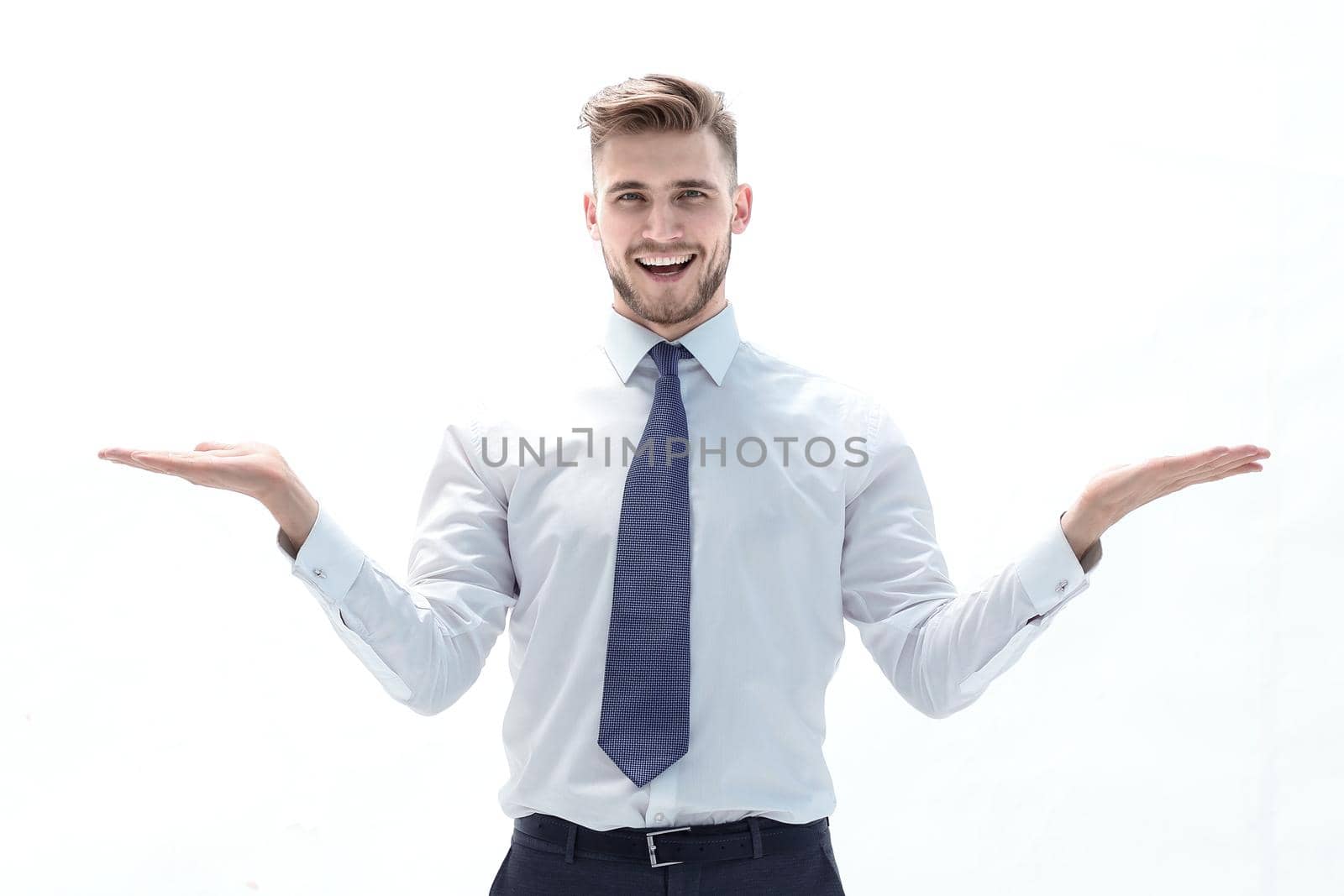 Charming businessman stretching out his palms with empty space .photo with text space