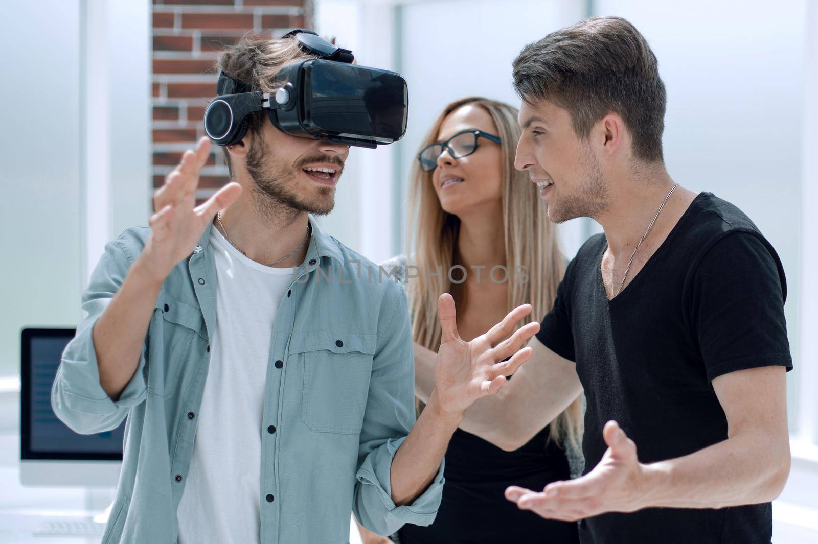 friends looking in VR goggles and gesturing with hands