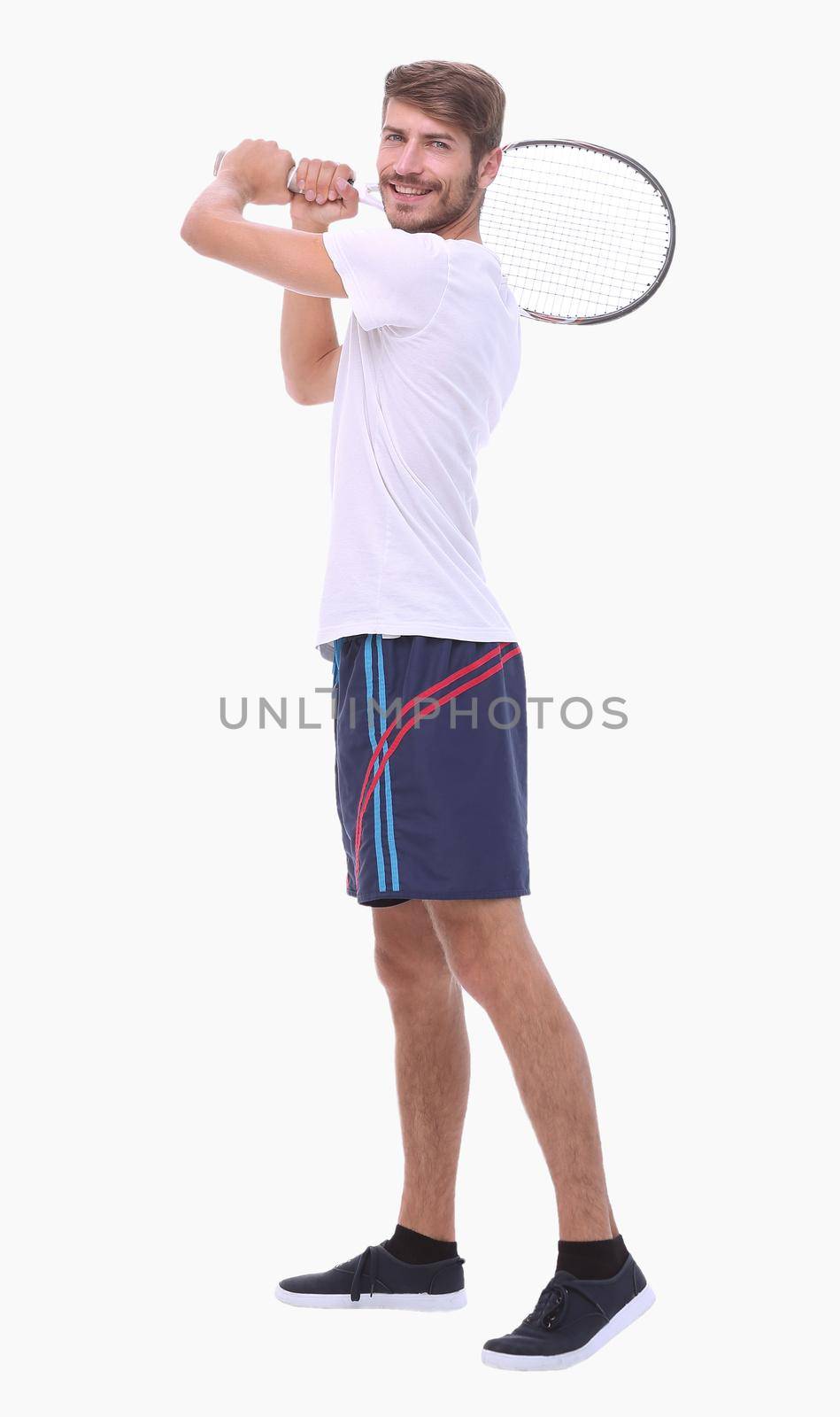 in full growth. a young man with a tennis racket. isolated on white background