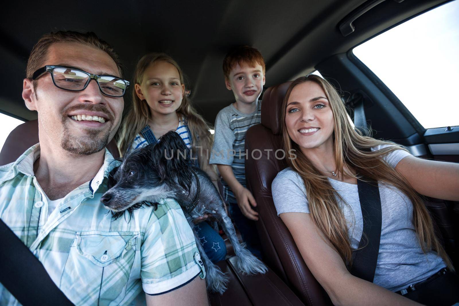 close up. happy family travels in a comfortable car by asdf
