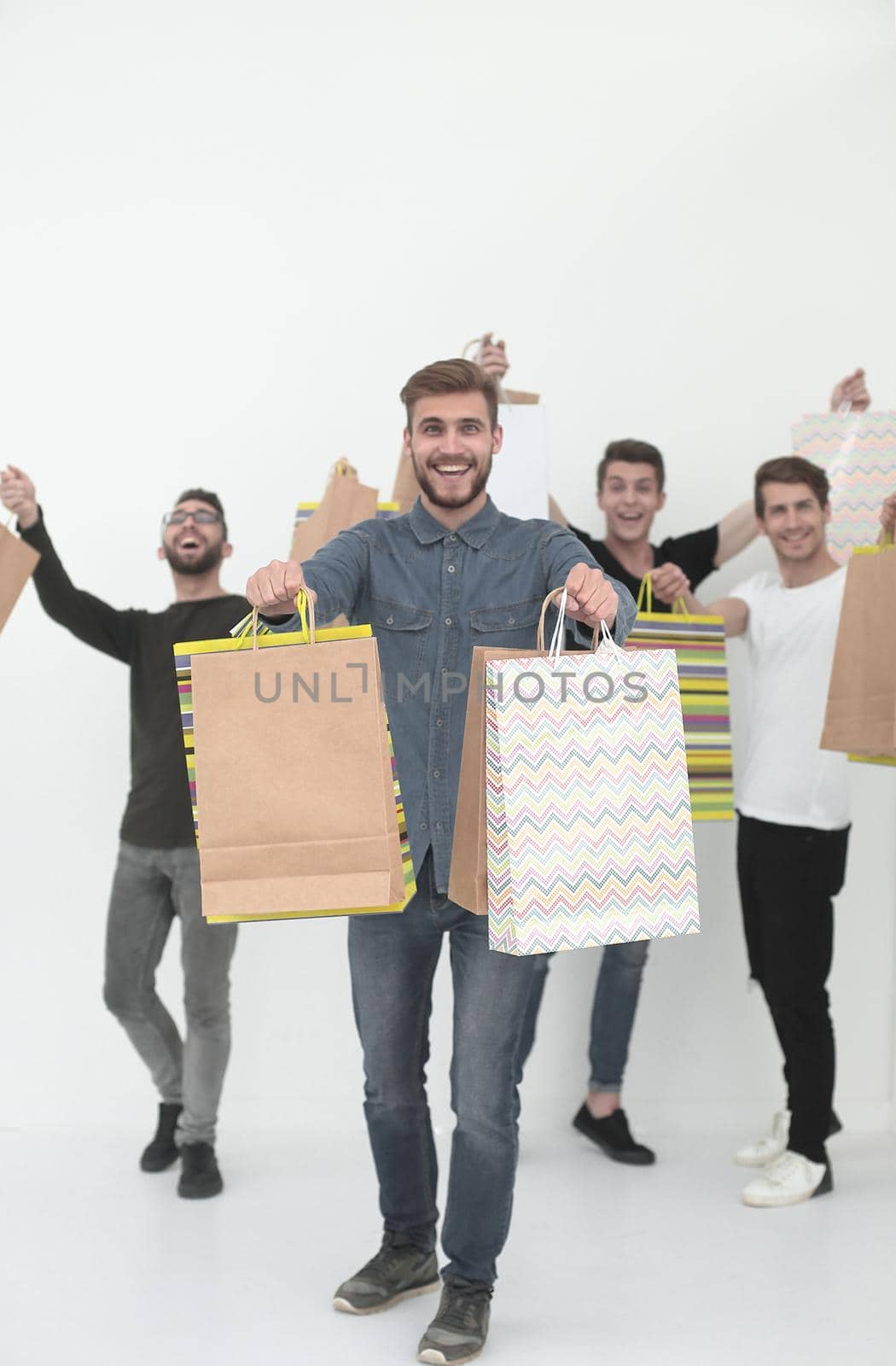 group of cheerful young people with shopping bags.photo with text space