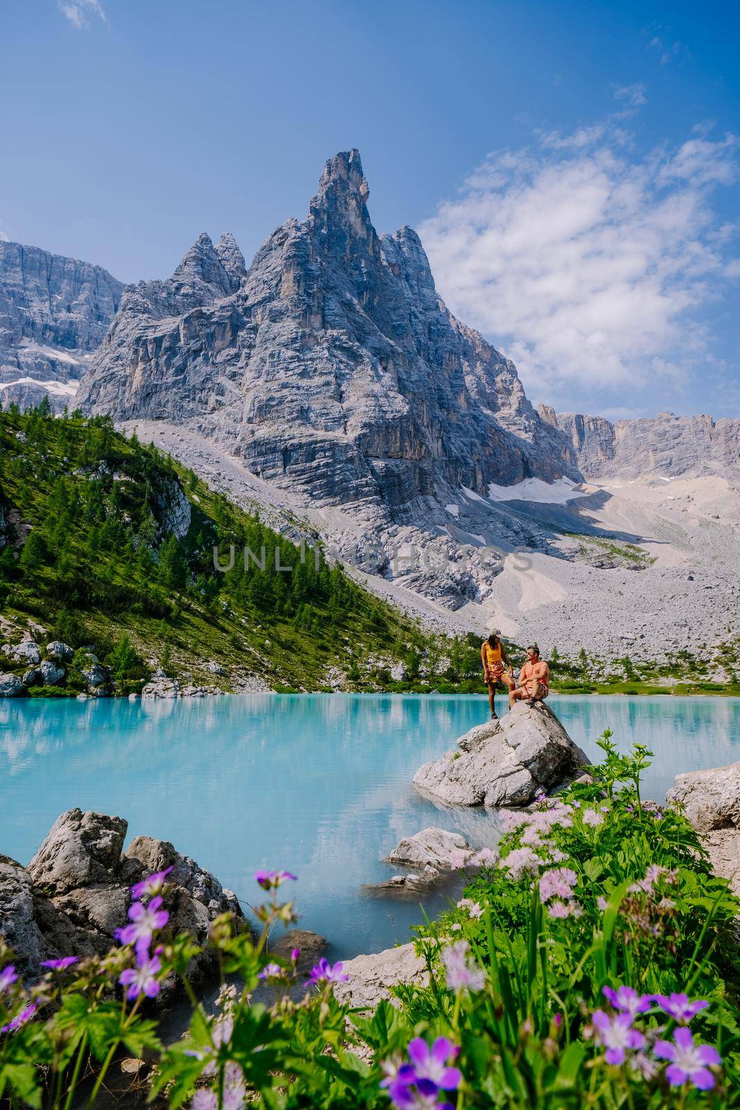 Lake Sorapis Italian Dolomites, Morning with clear sky on Lago di Sorapis in italian Dolomites, lake with unique turquoise color water in Belluno province in Nothern Italy by fokkebok