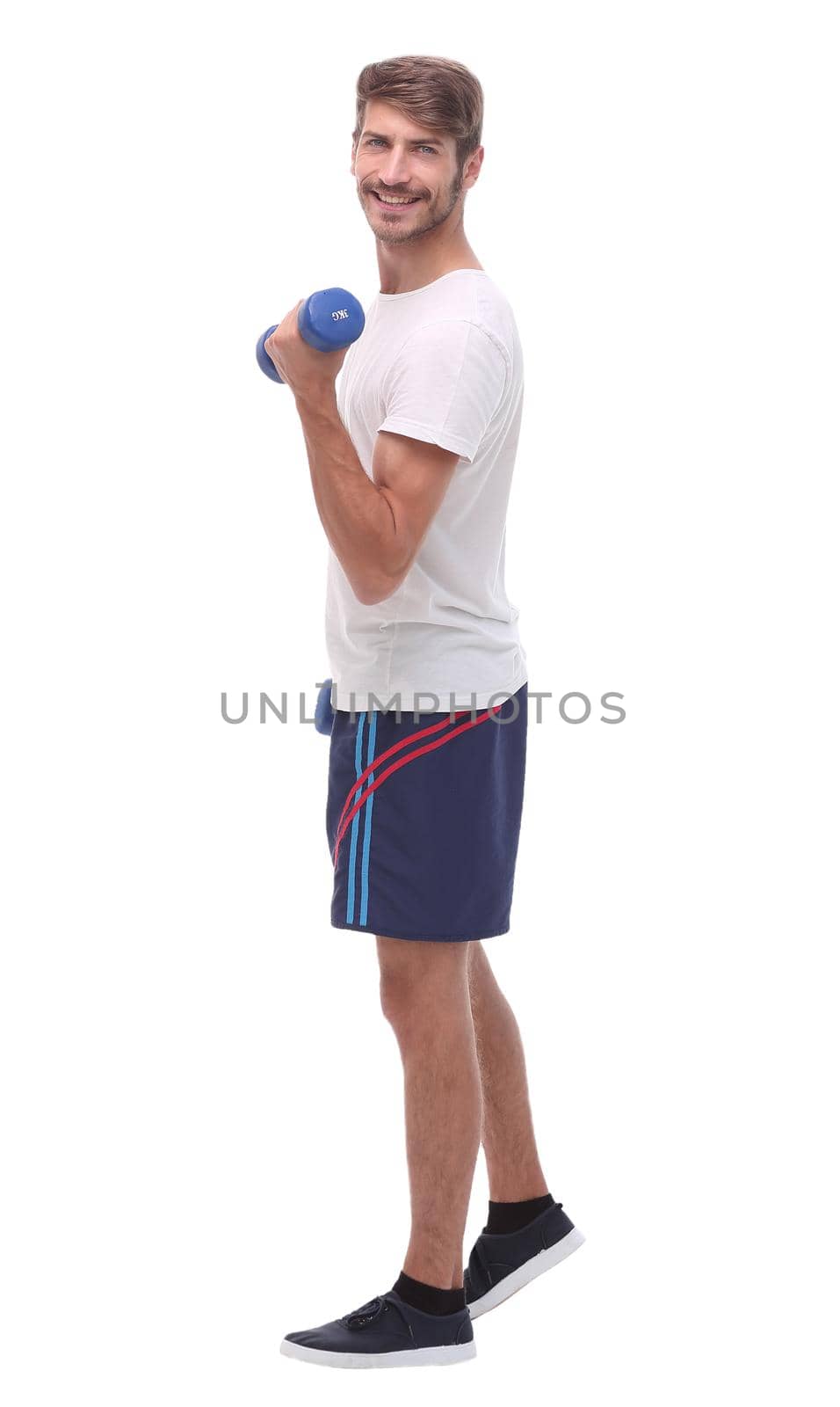 in full growth.young man with dumbbells.isolated on white background