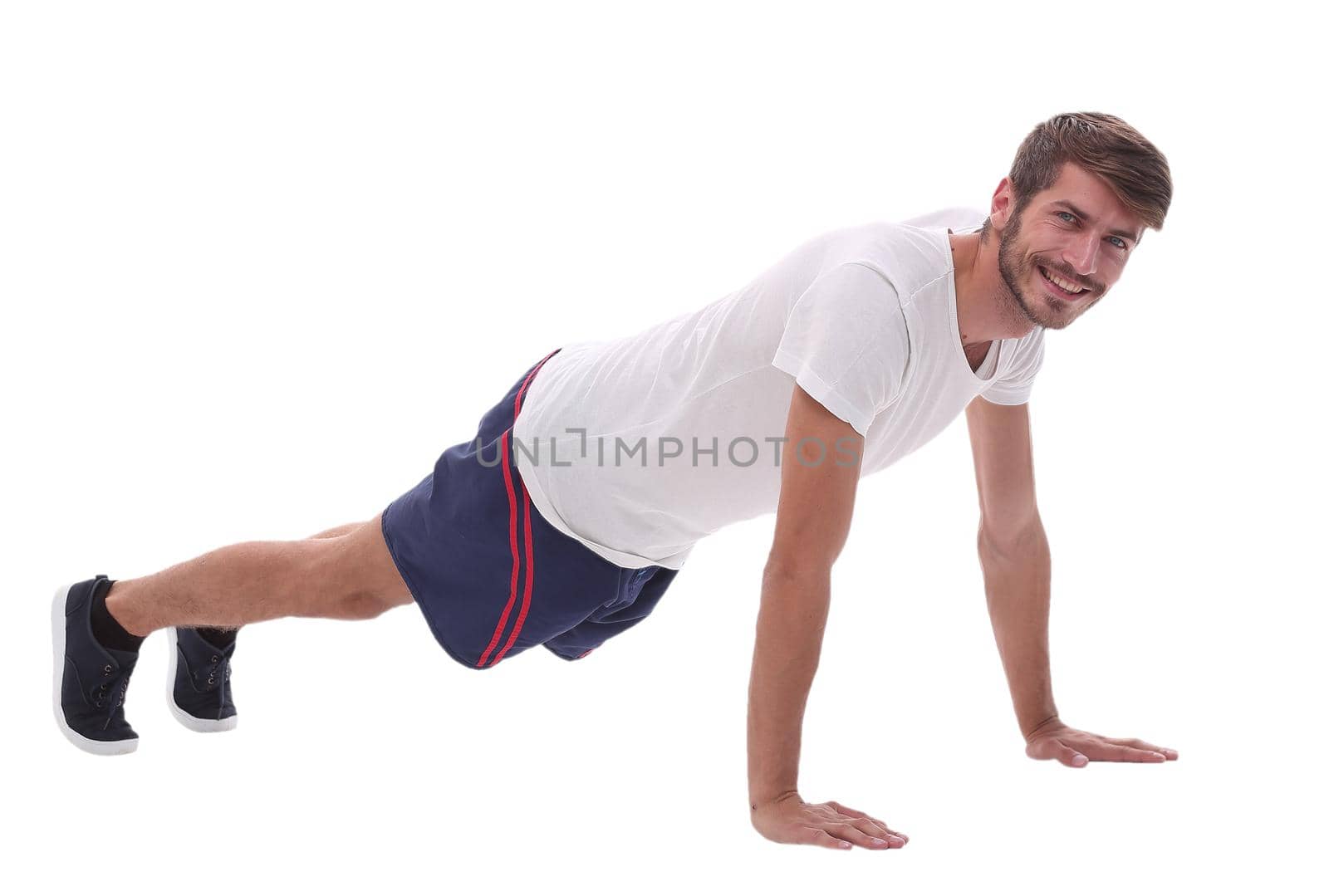 in full growth. a man performs a push-up from the floor.photo with copy space