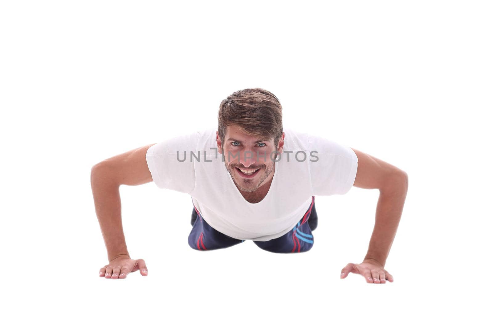 in full growth. a man performs a push-up from the floor.photo with copy space