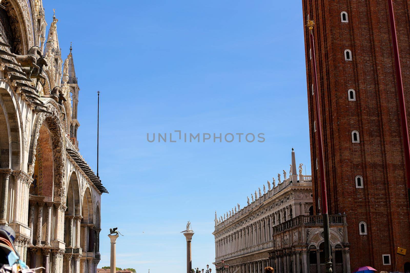 Exterior of Saint Mark Basilica and buildings. Concept of last minute tours to Venice and famous landmarks of Italy.