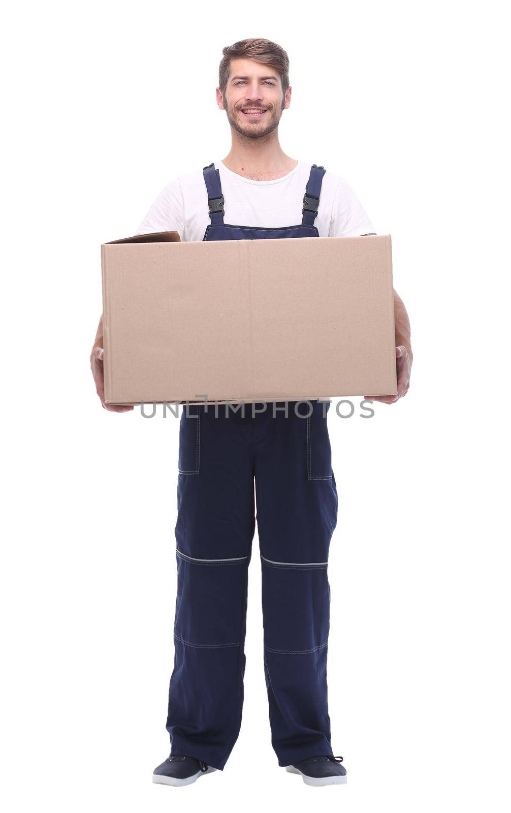 in full growth. a man in a jumpsuit holding a large box.isolated on white background