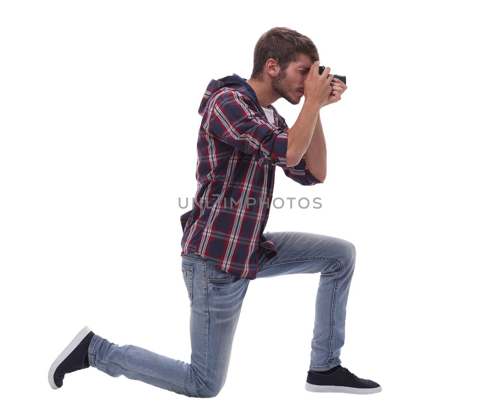 full-length . young man photographer with camera.isolated on white background