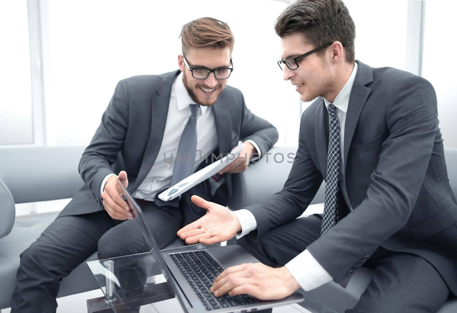 close up.business colleagues use a laptop to check financial data .people and technology