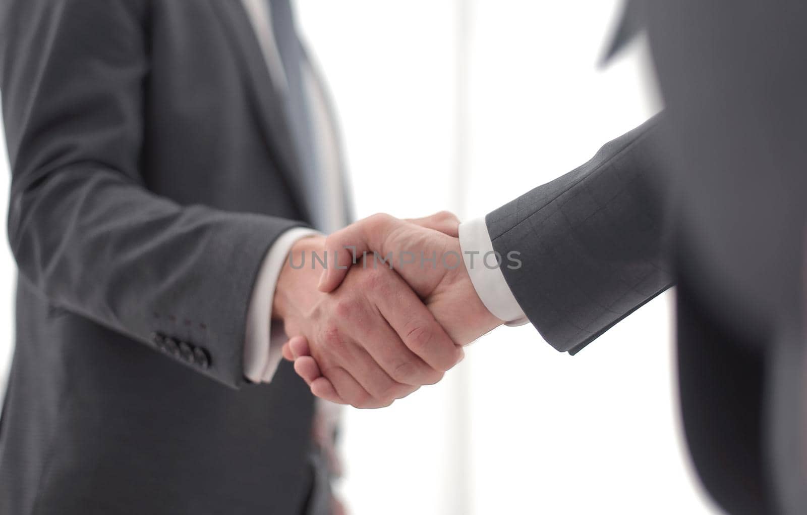 close up. handshake of business people on a light background.the concept of cooperation