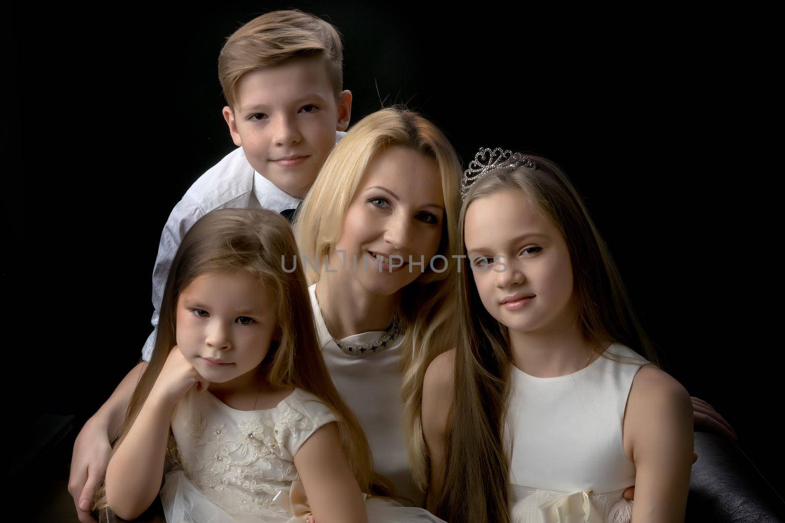 Big happy family with children on a black background. Concepts people, holidays, happiness, harmonious development of the child in the family.