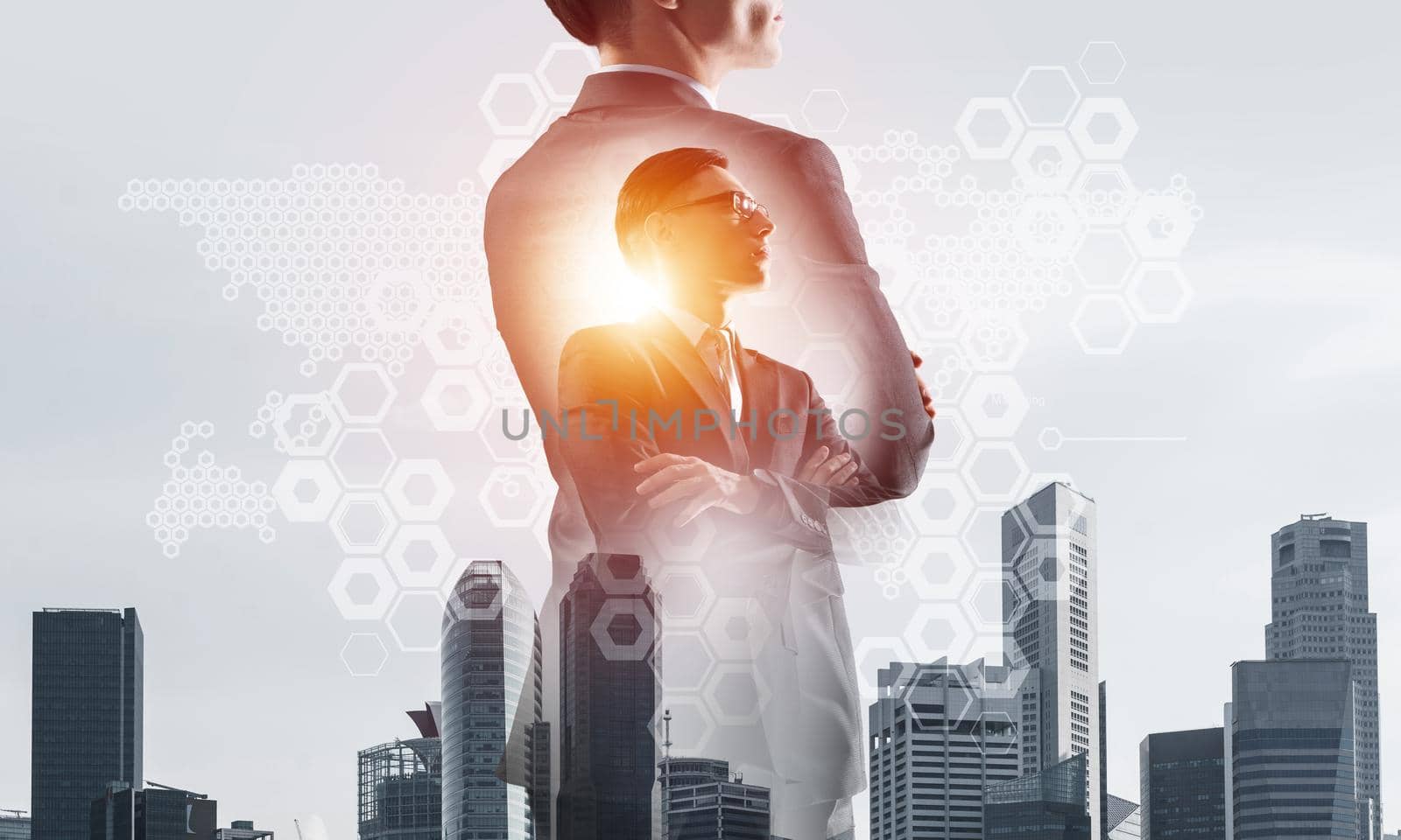 Double exposure of elegant businessman and modern busines city with towers and skyscrapers