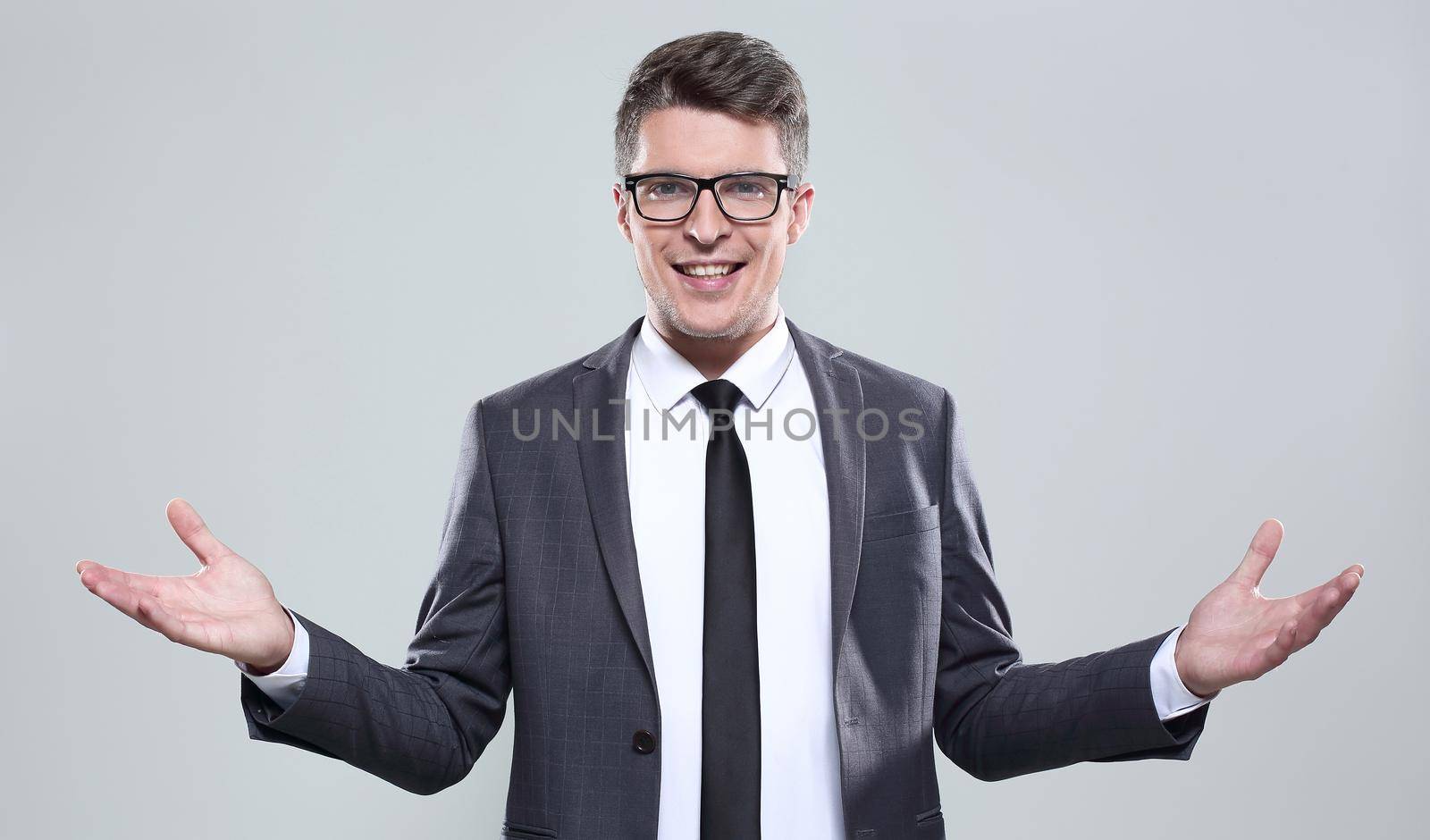 young man in a suit smiling by asdf