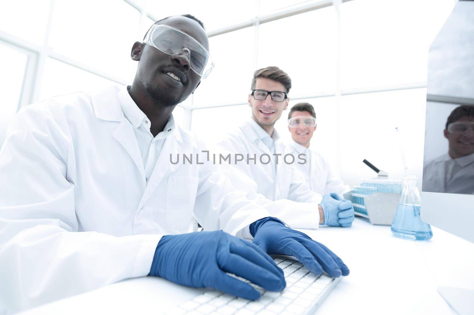 group of scientists sitting at the laboratory table.science and technology