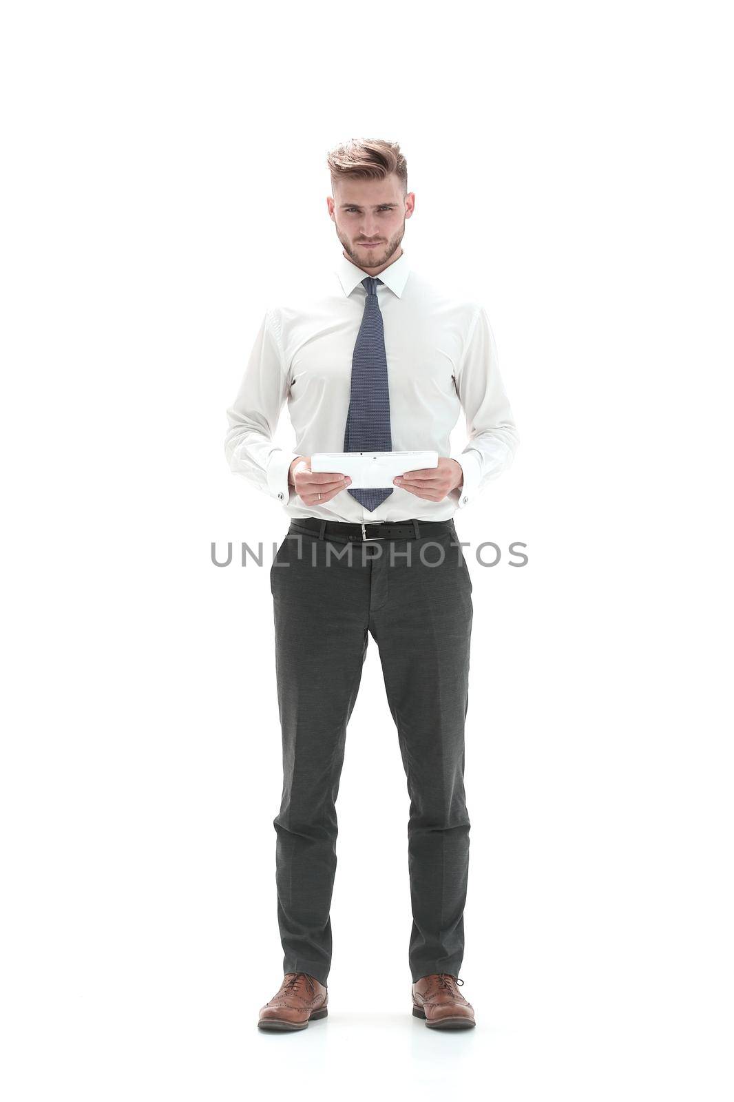 in full growth. modern businessman with a digital tablet.isolated on white background